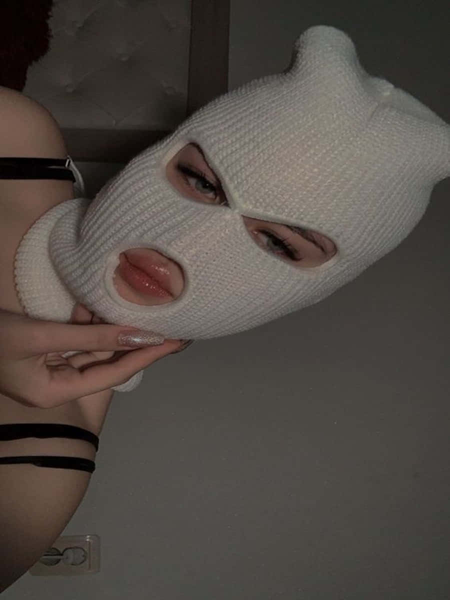 A Woman Wearing A Global Ski Mask, Ready For Winter. Background