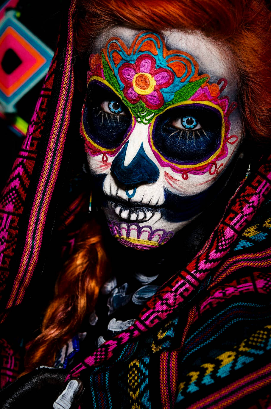 A Woman With A Colorful Face Background