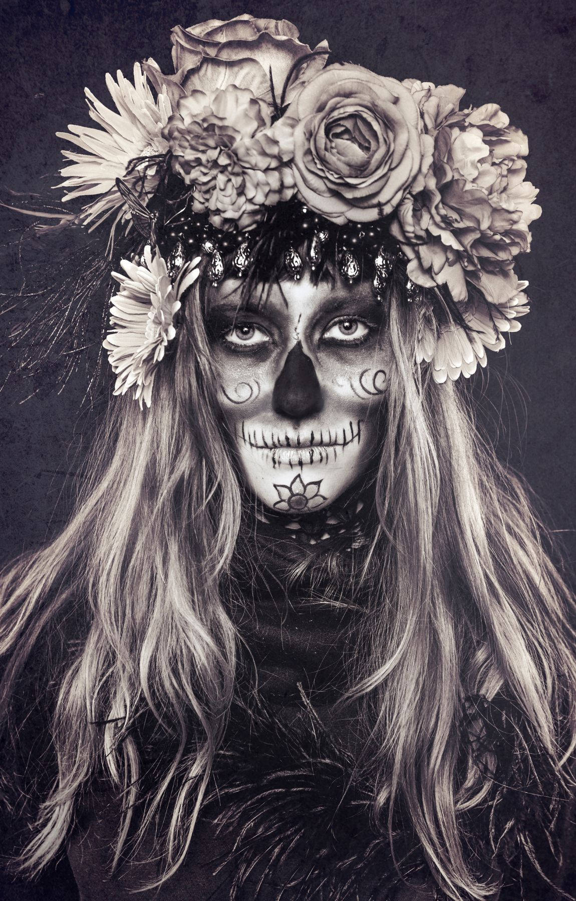 A Woman With A Skull Face And Flowers Background