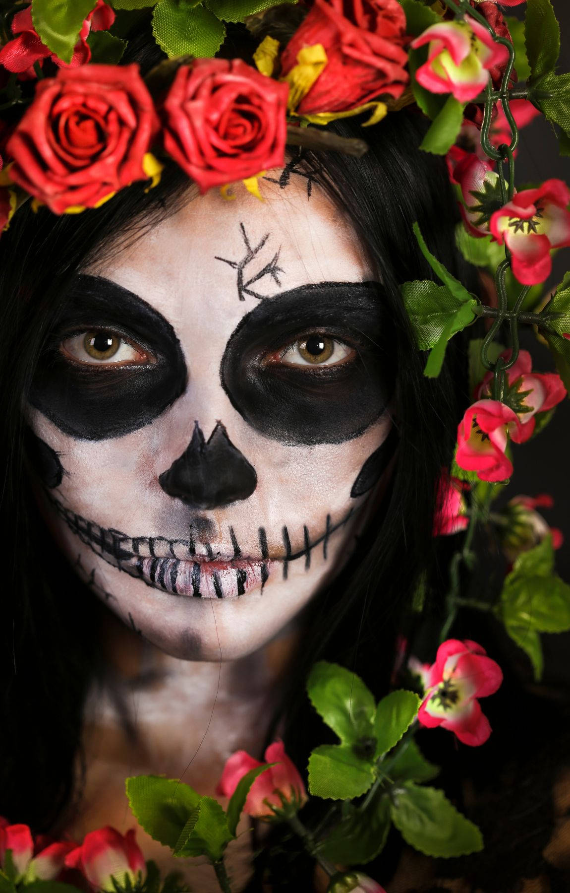 A Woman With A Skull Face And Flowers In Her Hair Background