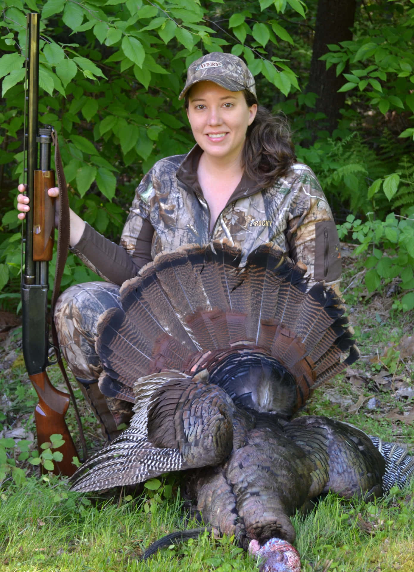 A Woman With A Turkey And A Rifle Background