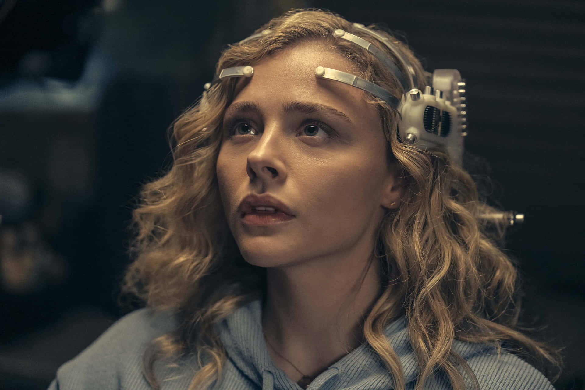 A Woman With Blond Hair Is Wearing Headphones Background