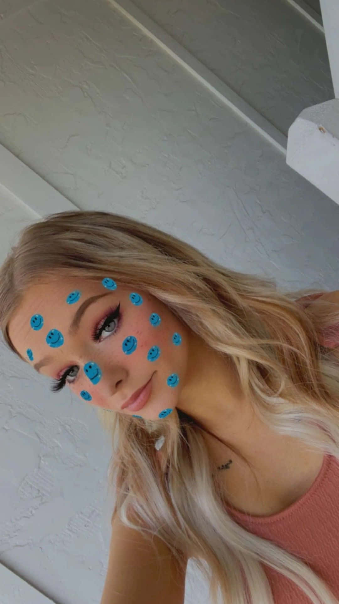 A Woman With Blue Dots On Her Face Background