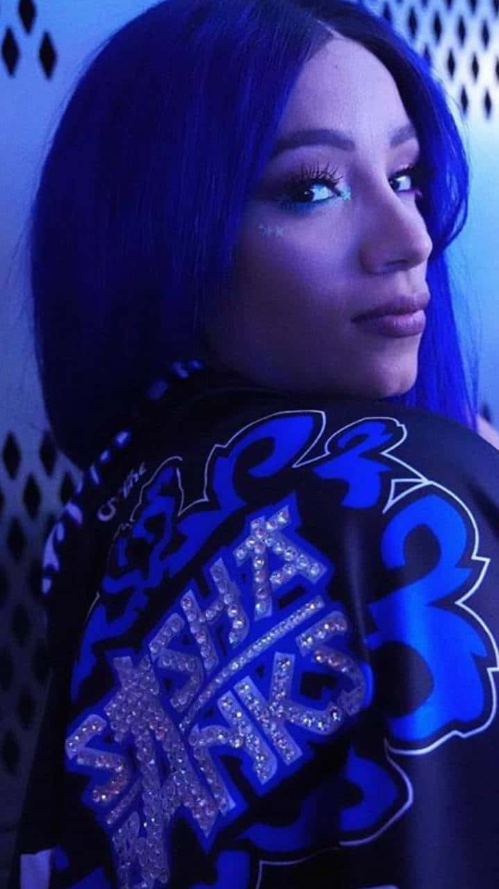 A Woman With Blue Hair Is Posing For A Photo