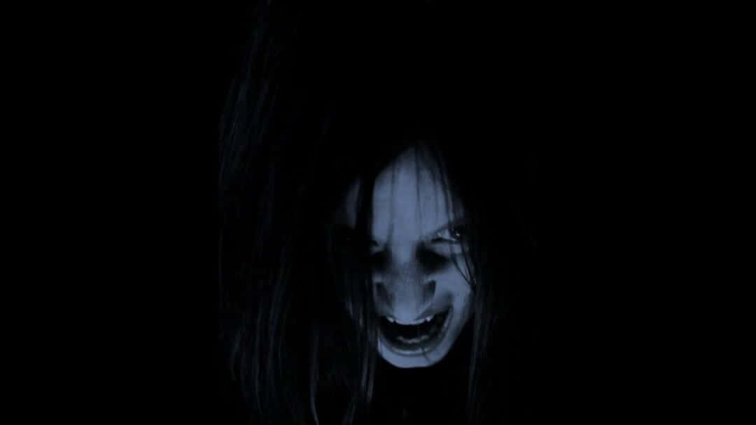 A Woman With Long Hair And A Scary Face Background