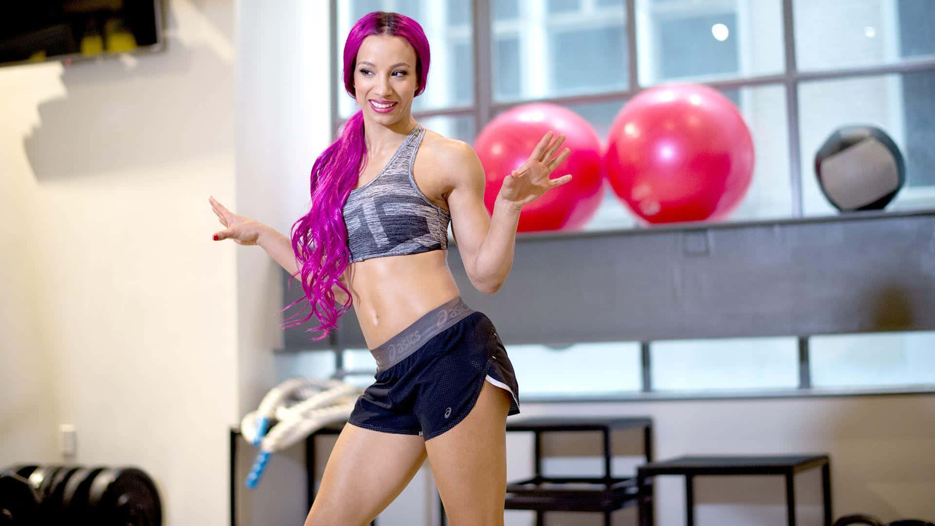 A Woman With Purple Hair Standing In A Gym