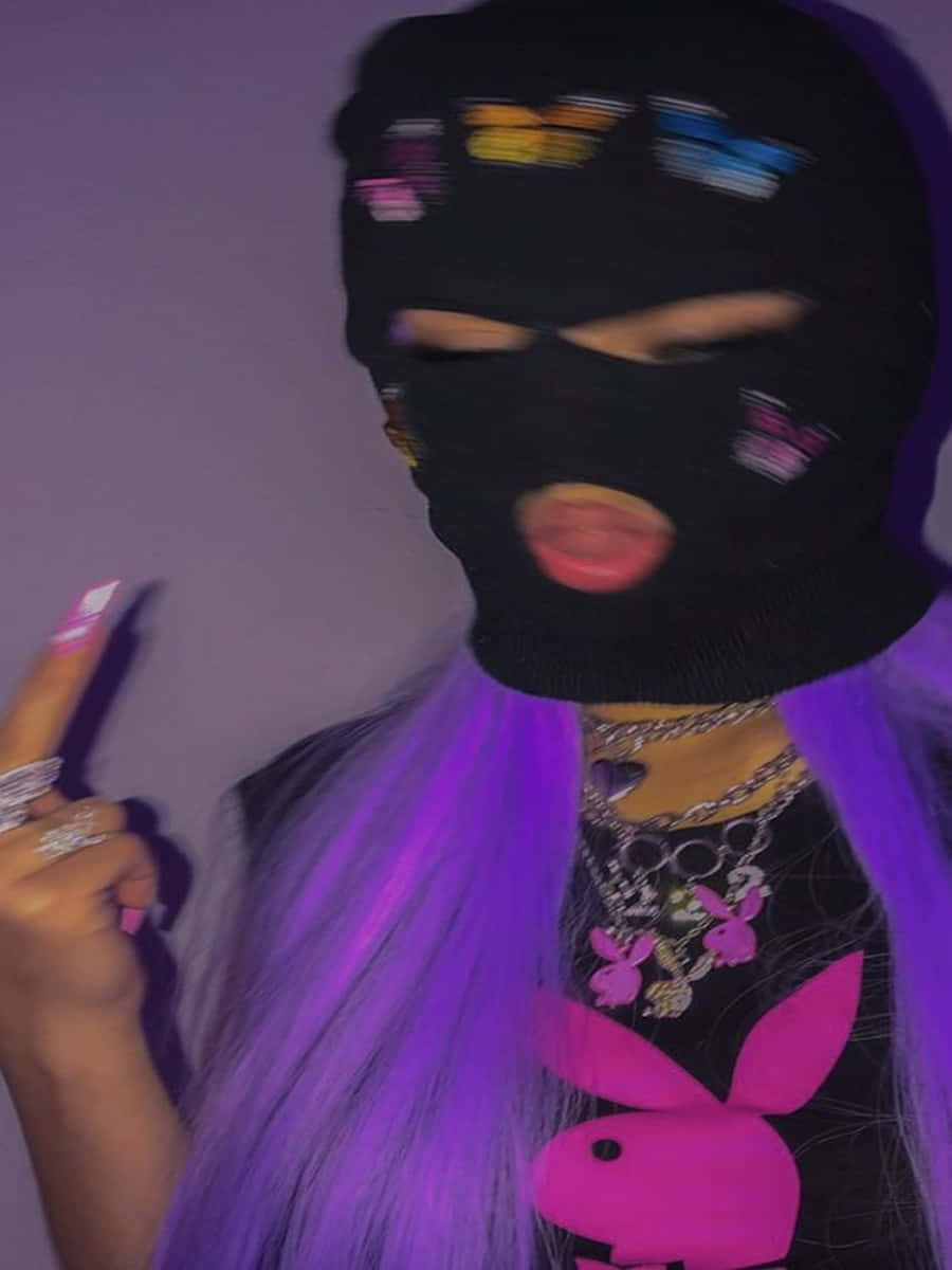 A Woman With Purple Hair Wearing A Black Mask Background