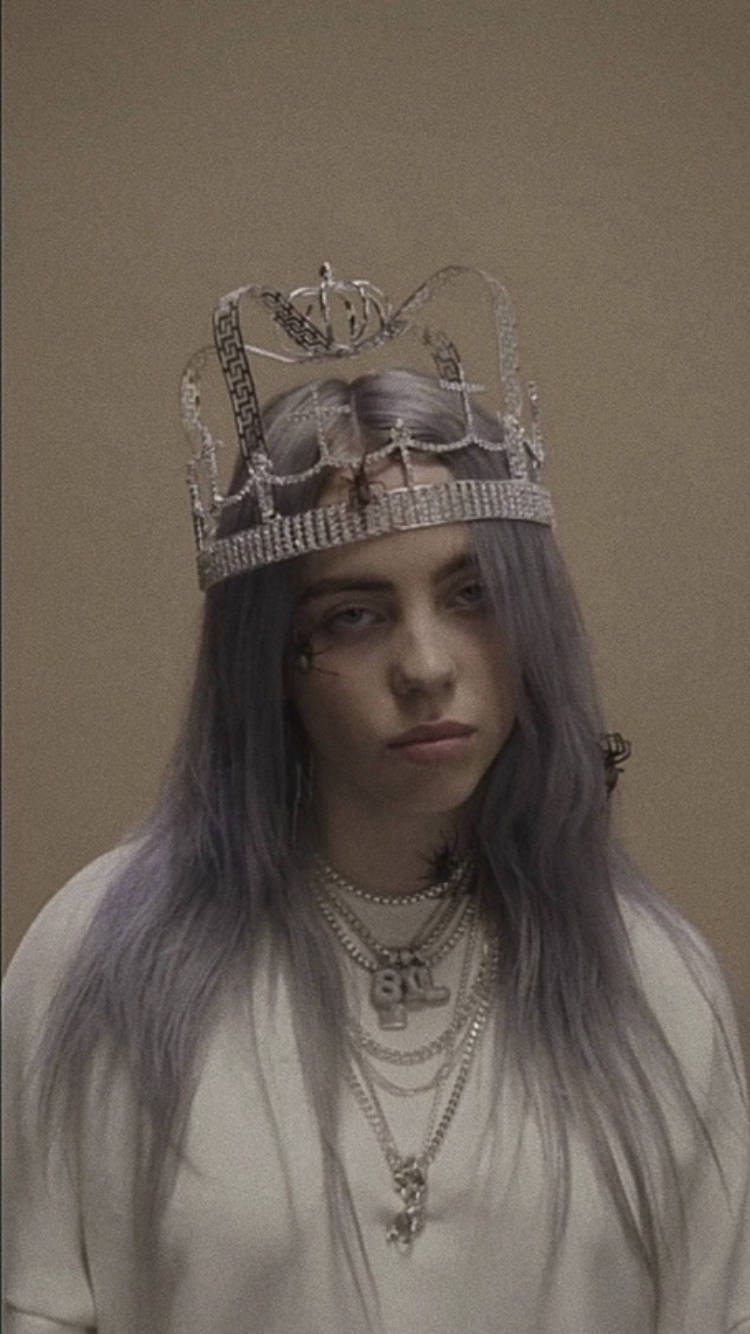 A Woman With Purple Hair Wearing A Crown
