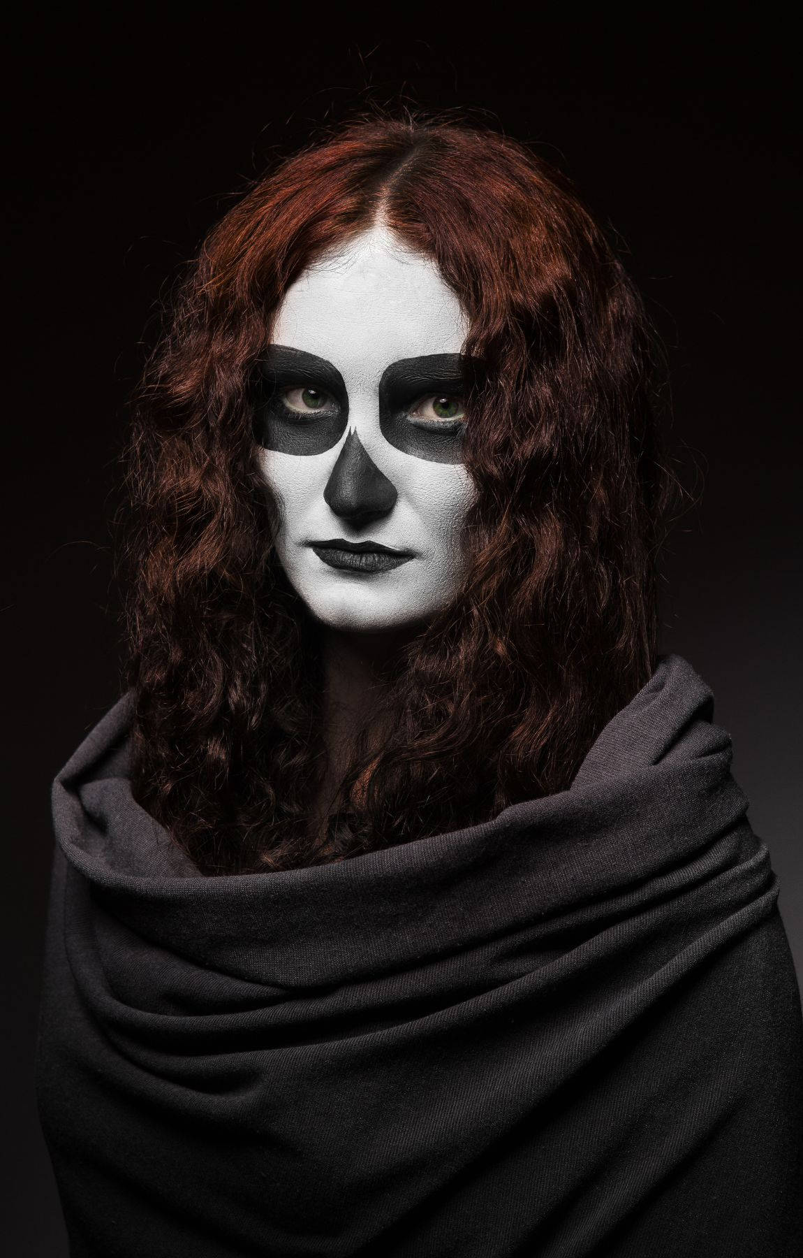 A Woman With Red Hair And White Makeup Background