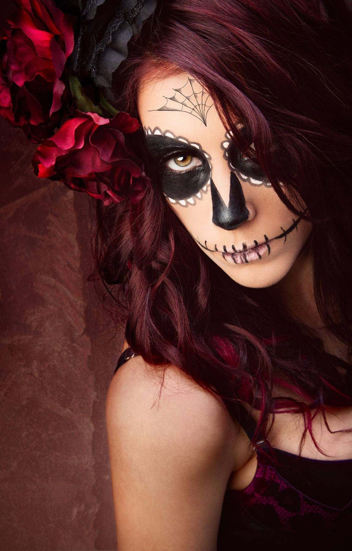 A Woman With Sugar Skull Makeup And Flowers Background