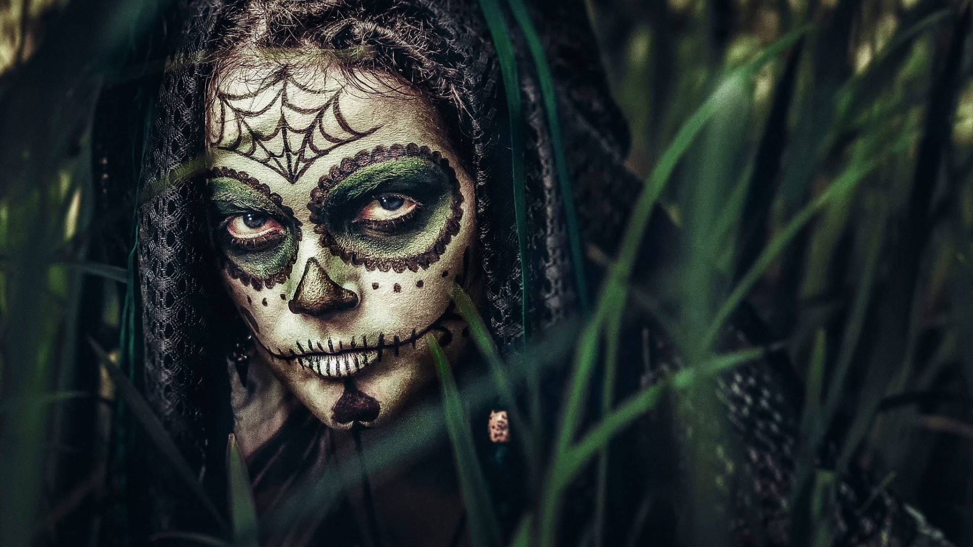 A Woman With Sugar Skull Makeup In Tall Grass Background