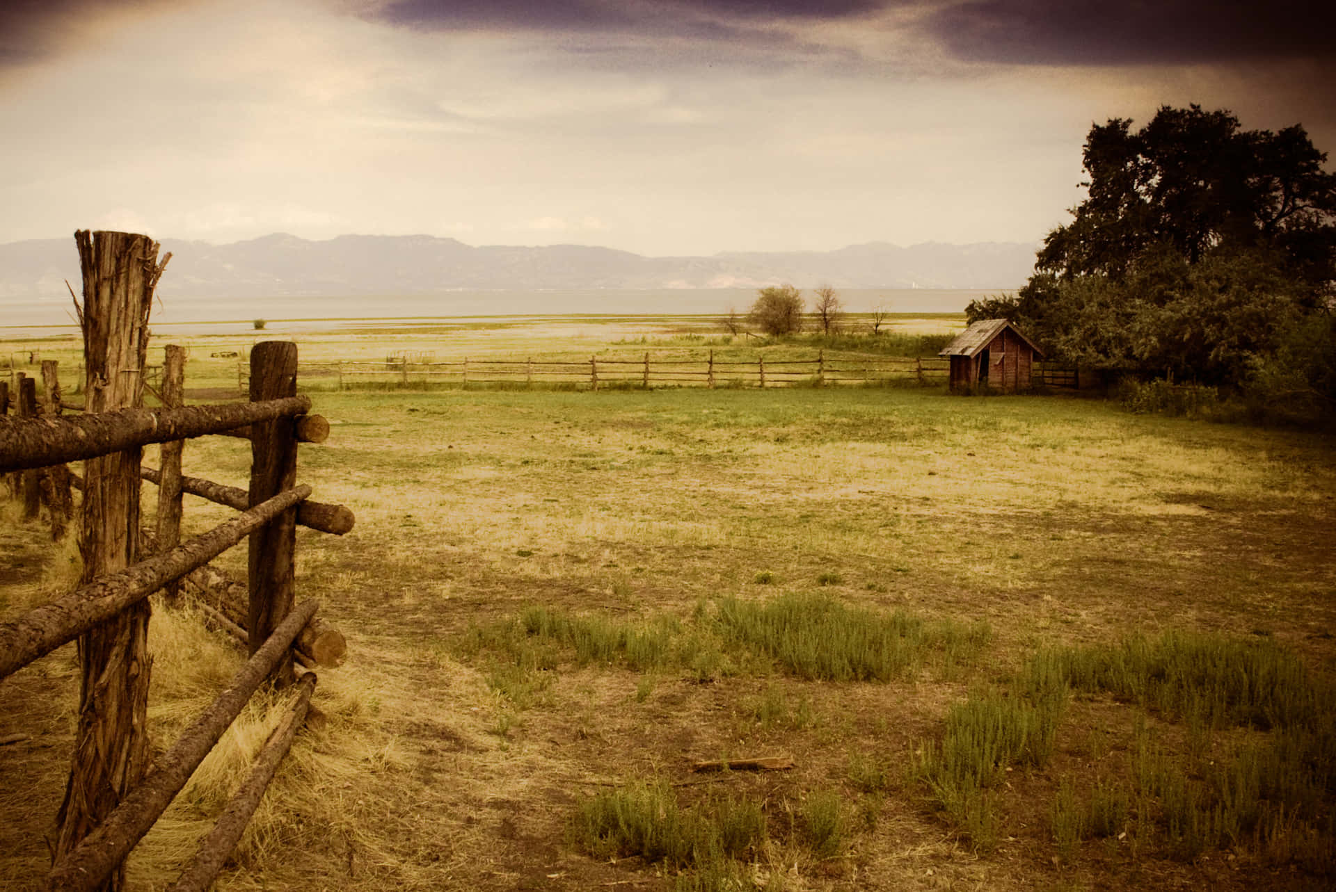 A Wooden Fence In A Field