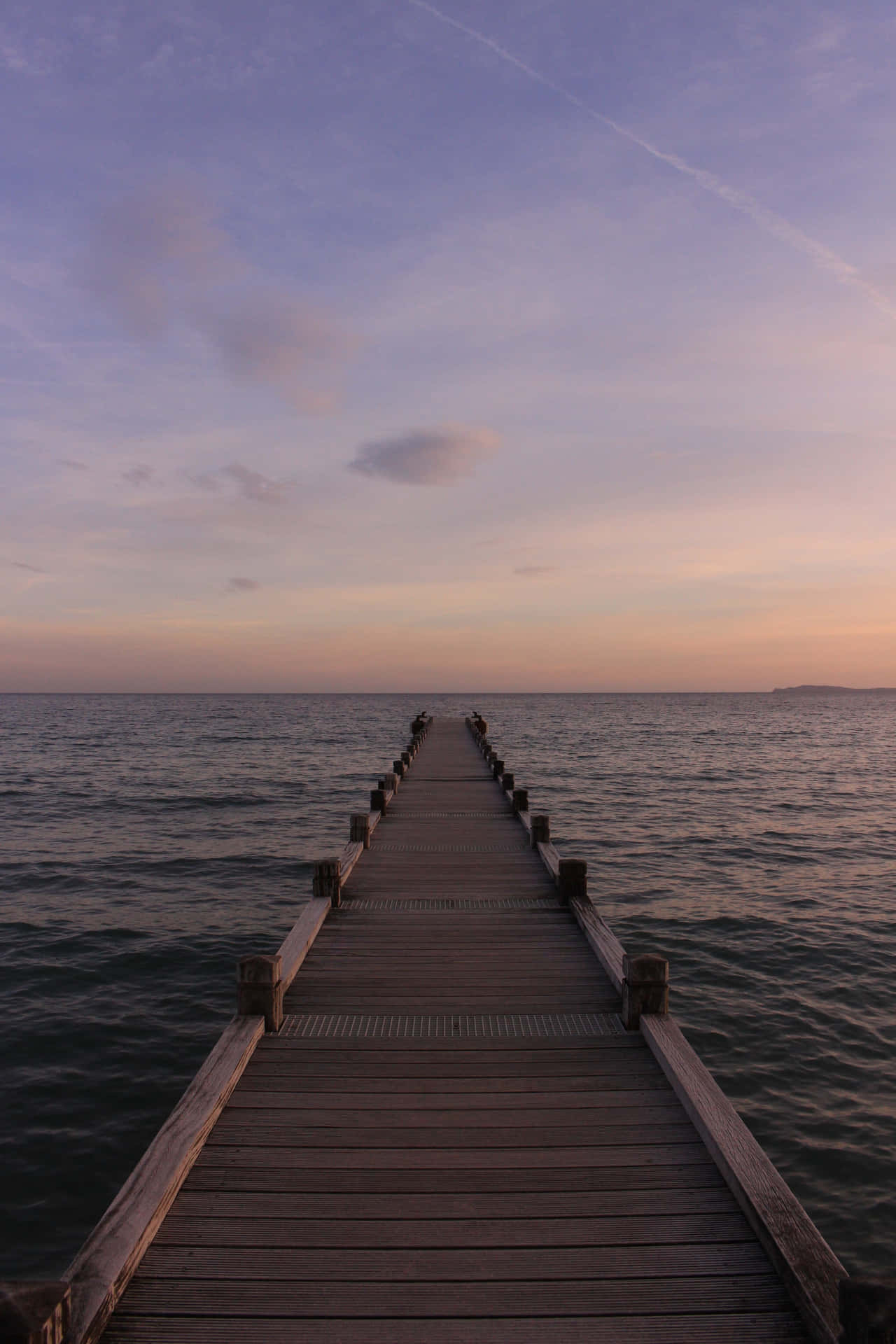 A Wooden Pier In The Water Background