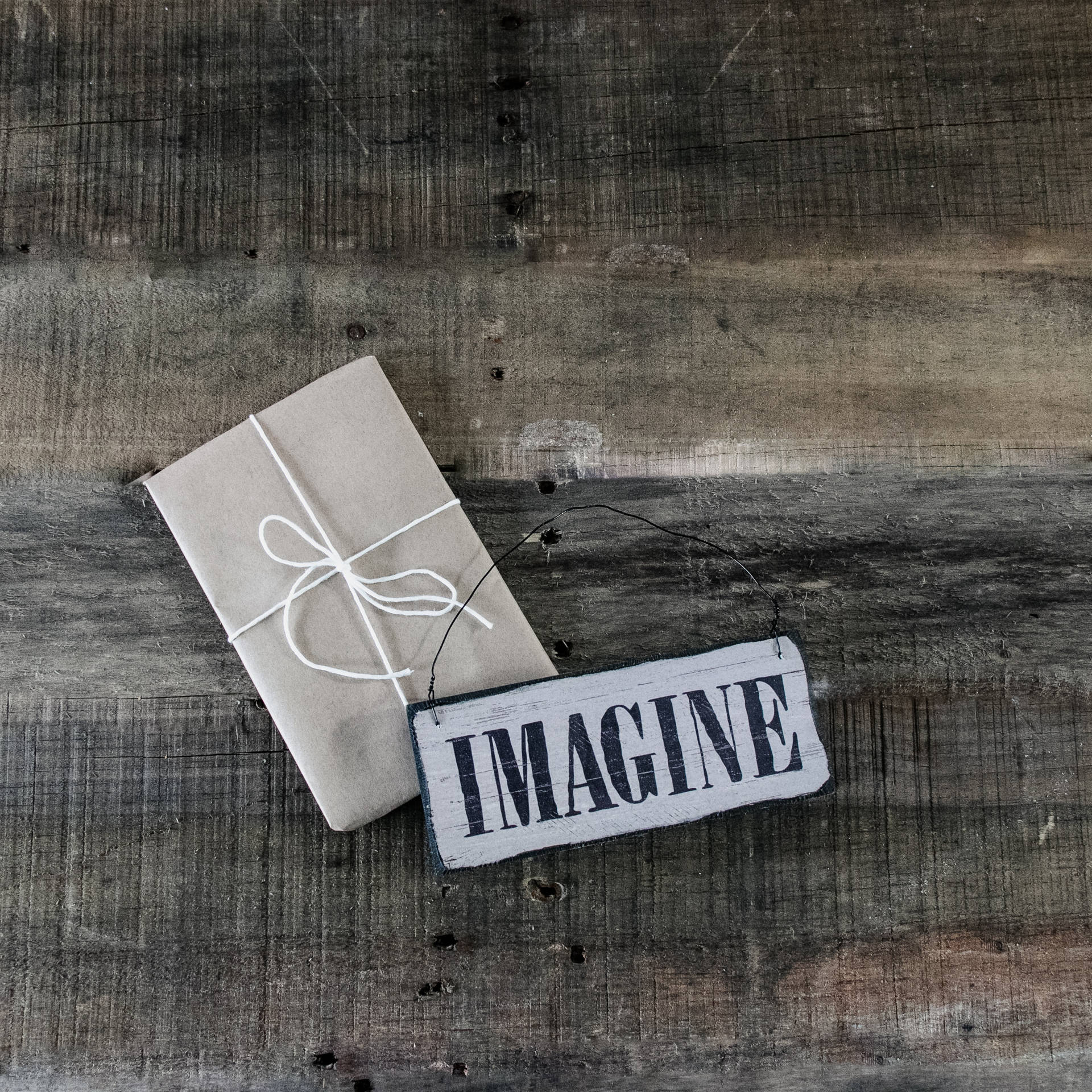 A Wooden Sign With The Word Imagine On It Background