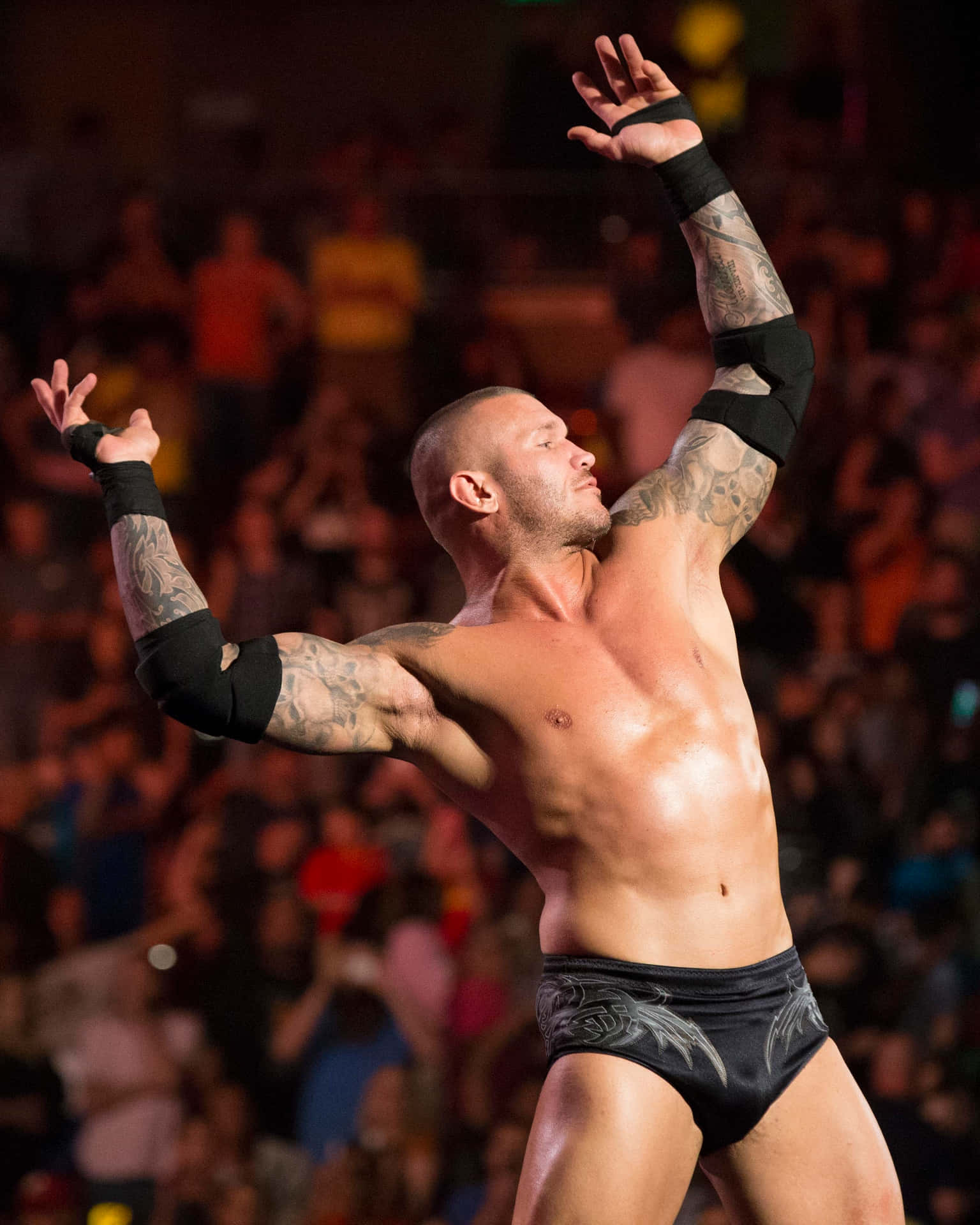 A Wrestler With Tattoos In The Air Background