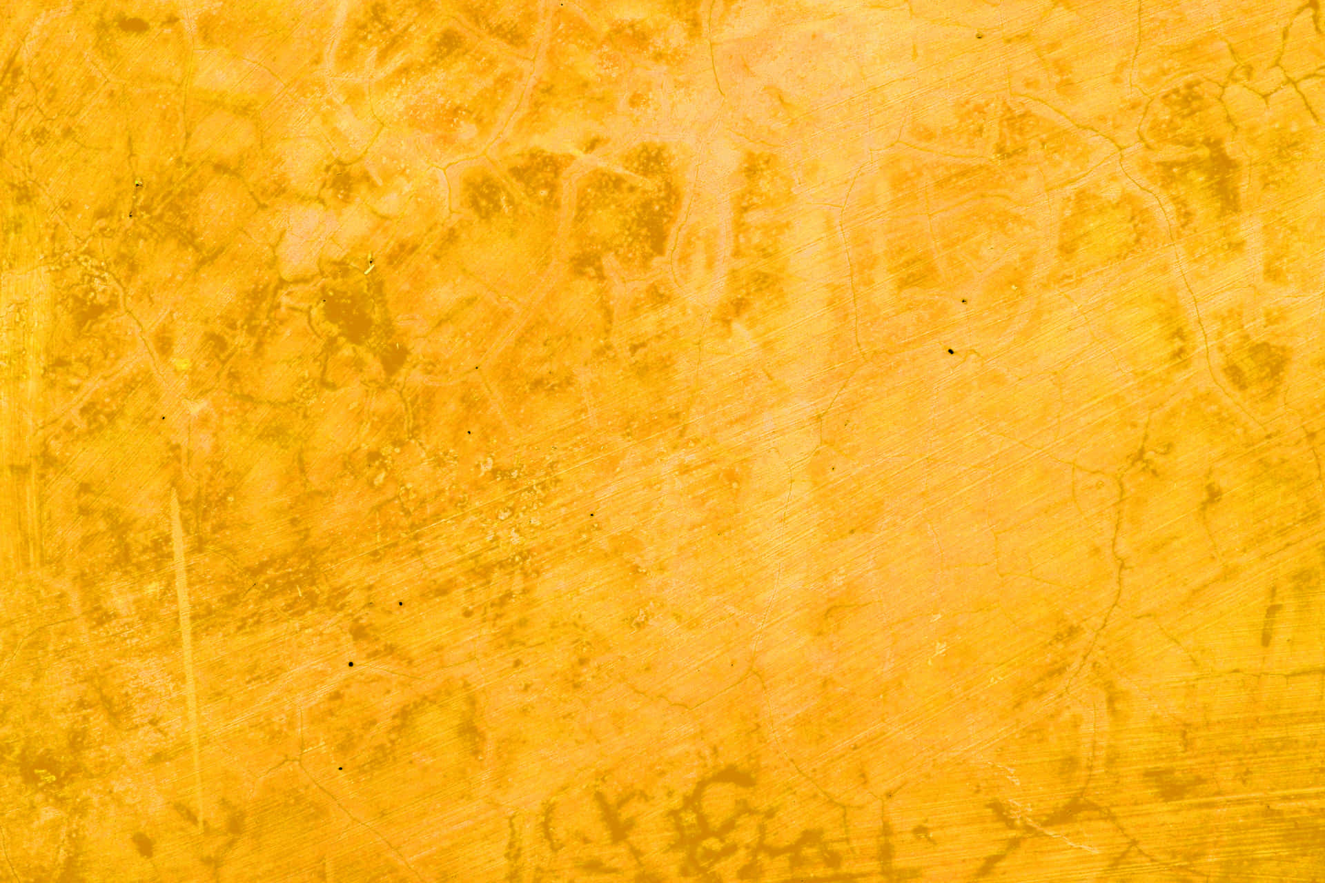 A Yellow Background With A Textured Surface Background