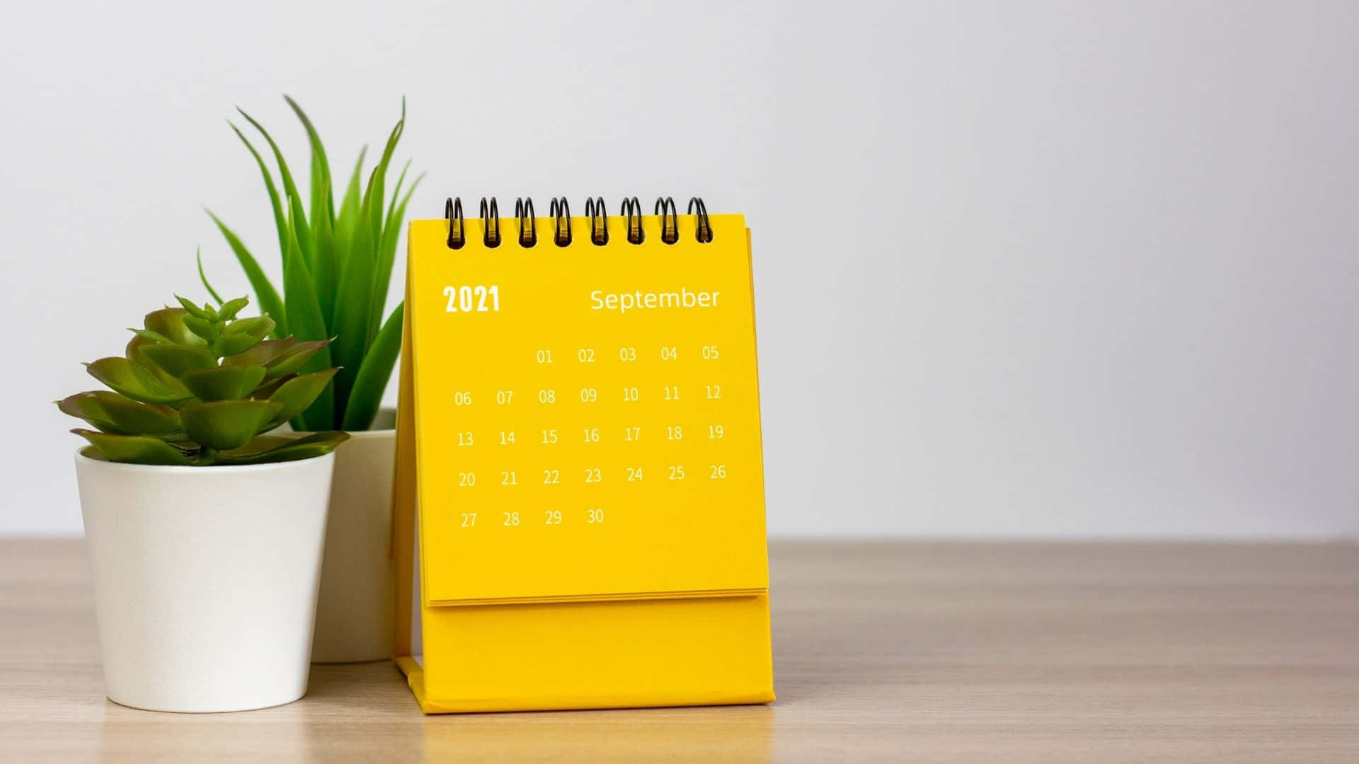 A Yellow Calendar On A Table