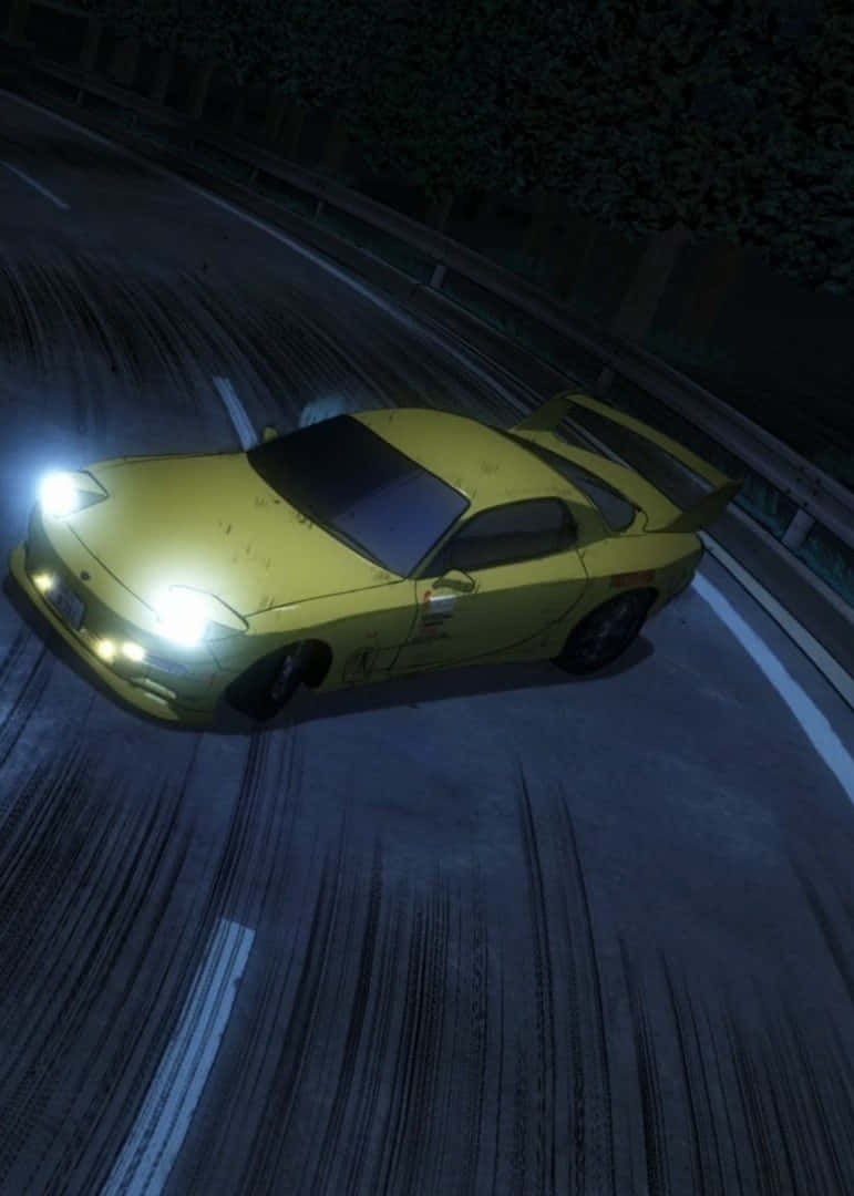 A Yellow Car Driving Down A Road At Night Background