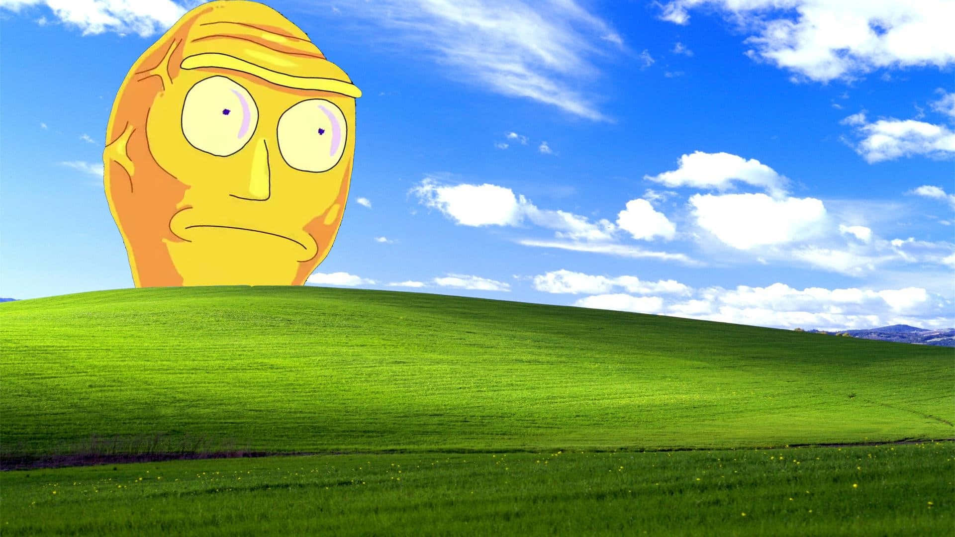 A Yellow Face On A Green Hill