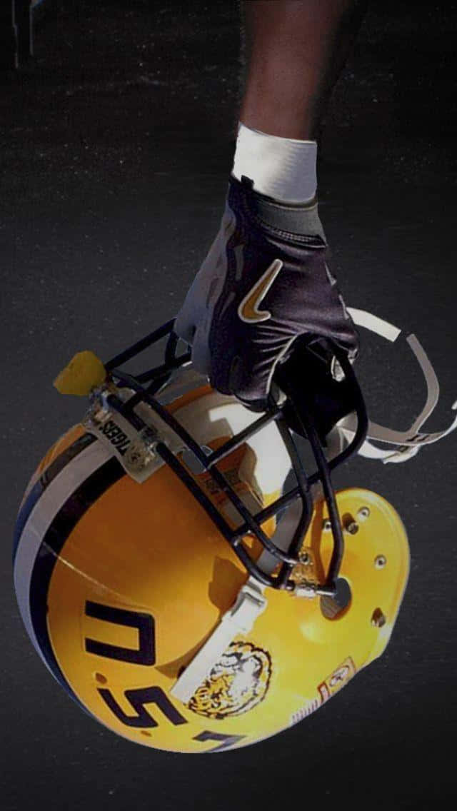 A Yellow Football Helmet With A Black Background Background