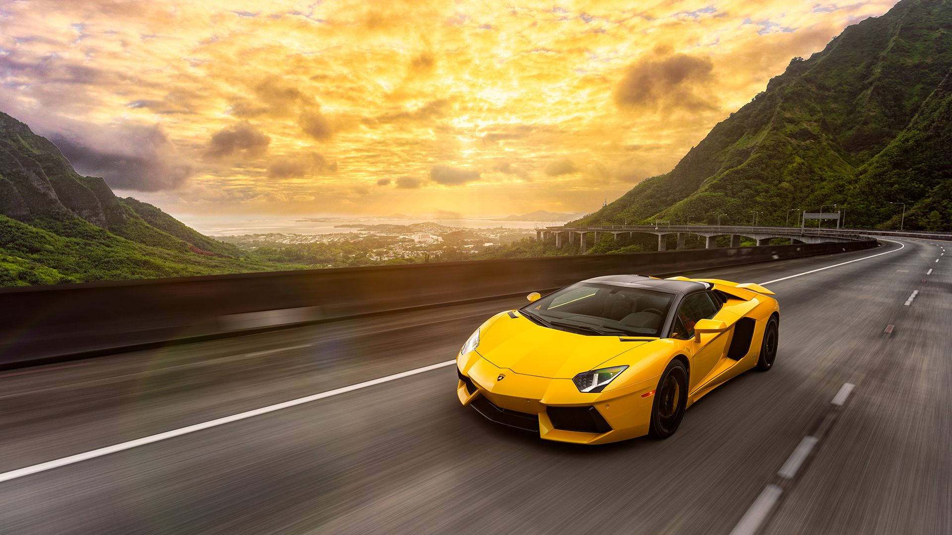 A Yellow Lamborghini Aventador In Motion. Background