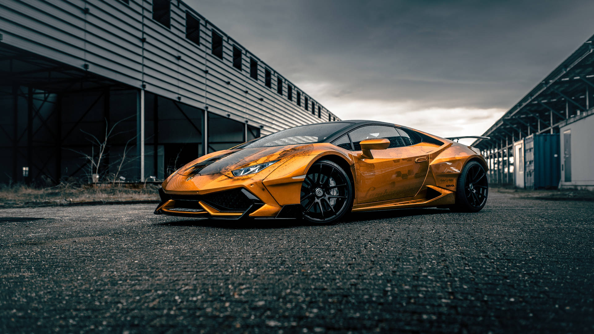 A Yellow Sports Car Parked In Front Of A Building Background