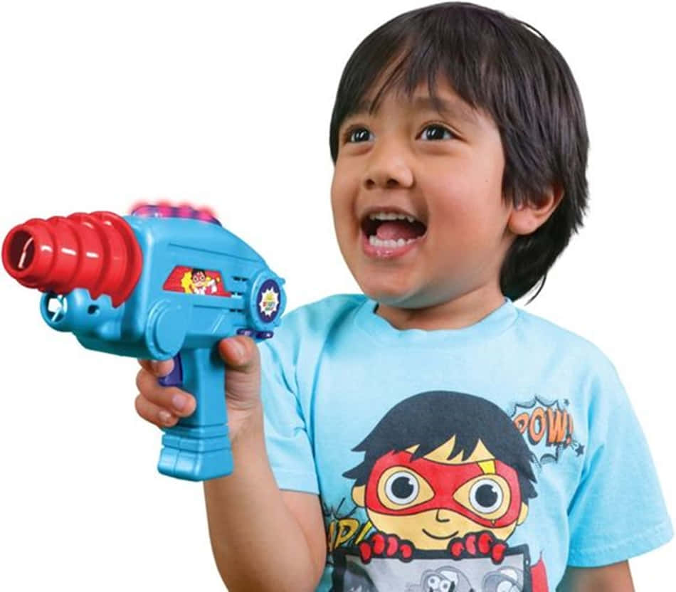 A Young Boy Holding A Toy Gun Background