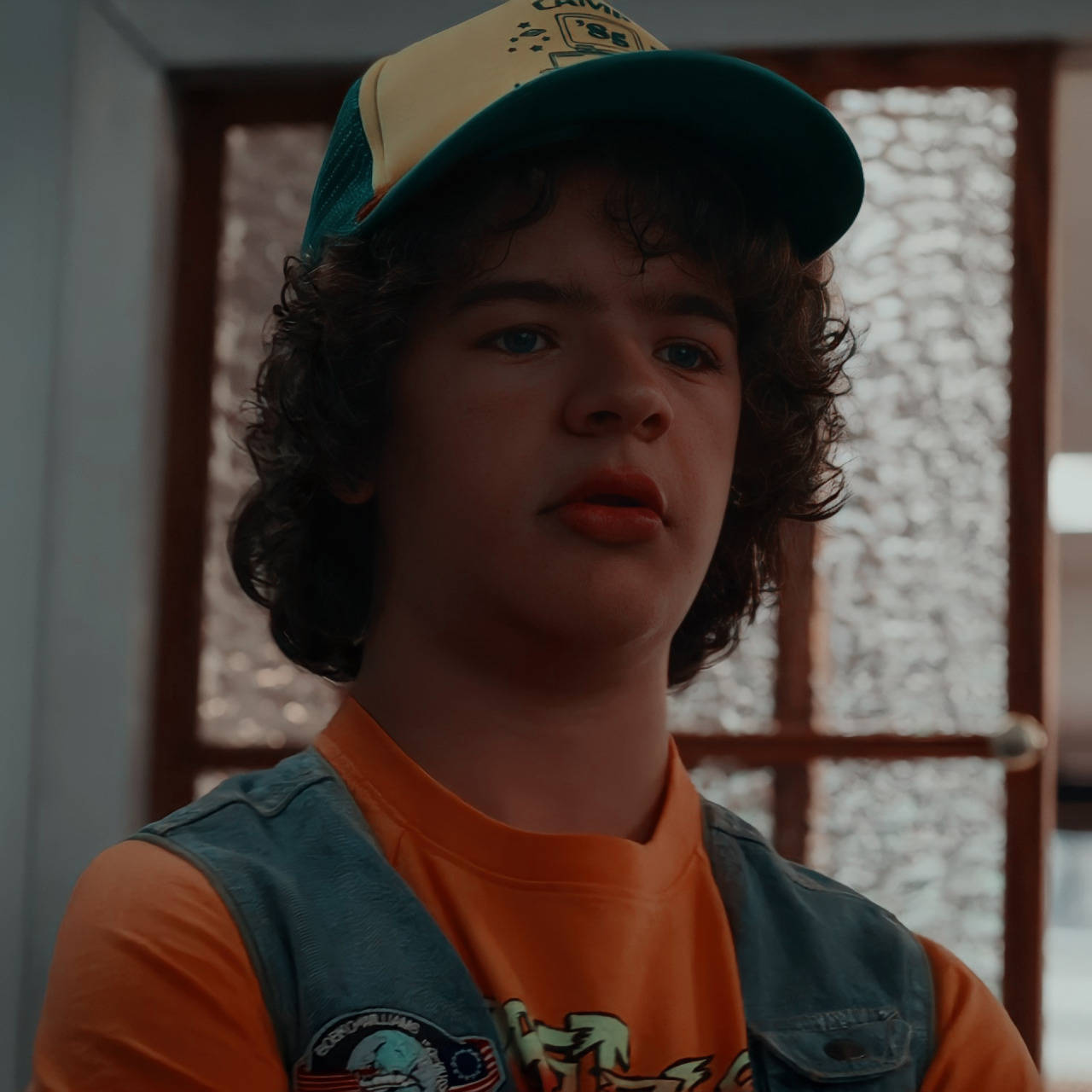 A Young Boy In A Hat And Vest Background