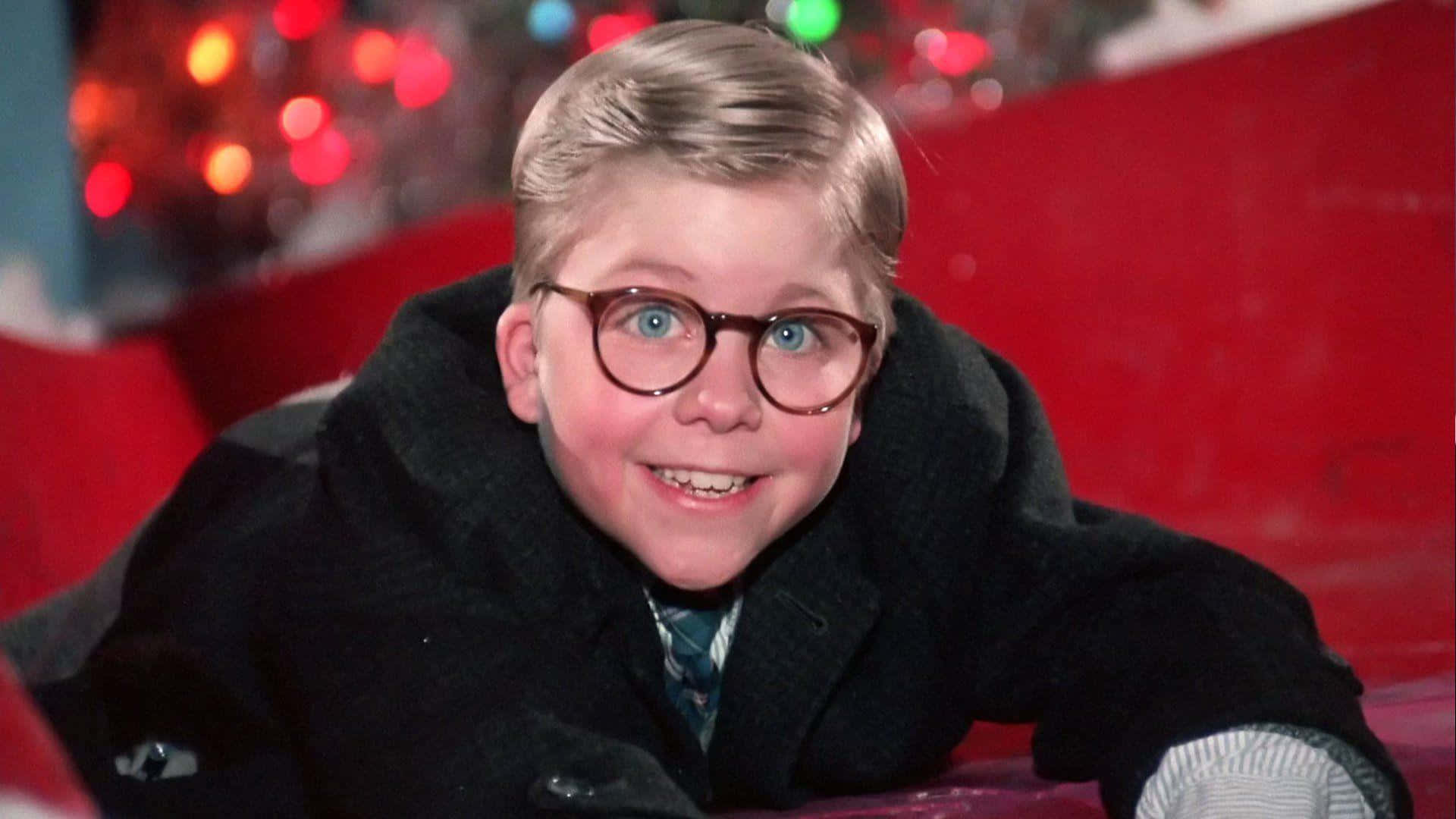 A Young Boy In Glasses Is Laying On A Christmas Tree