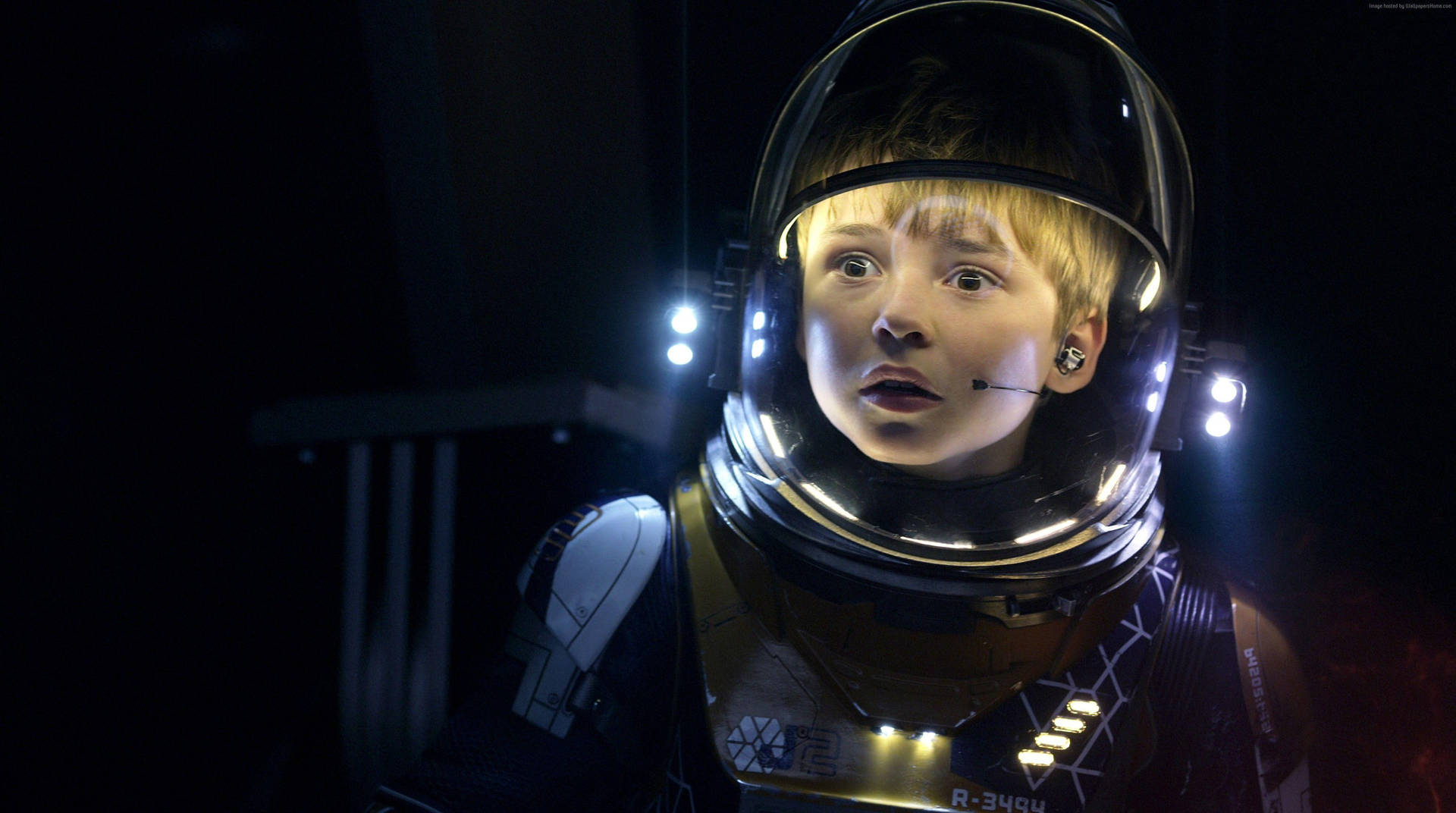 A Young Boy In Lost In Space Background