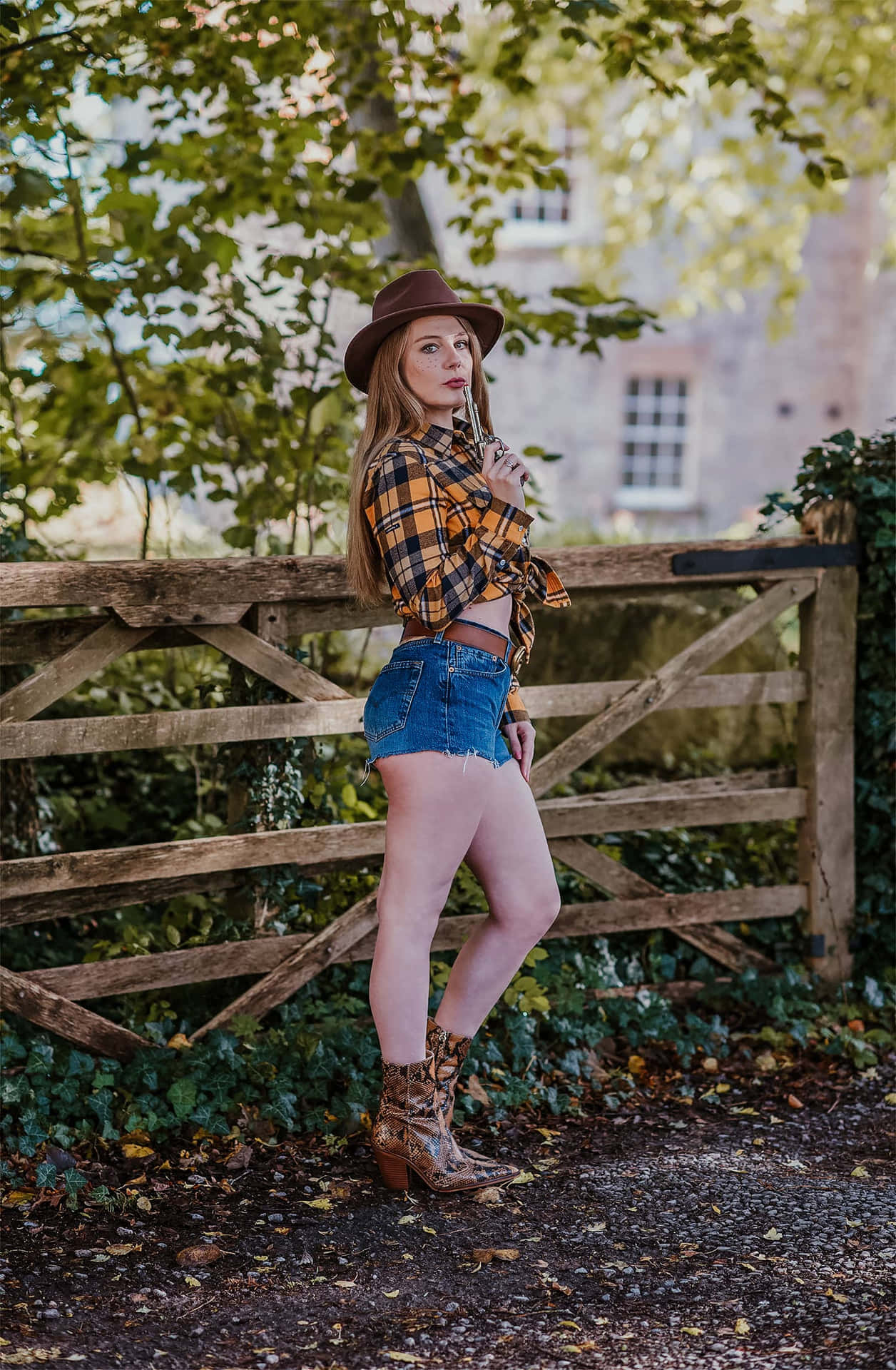 A Young Country Girl Dressed In A Plaid Shirt, Ready For A Summer Adventure. Background