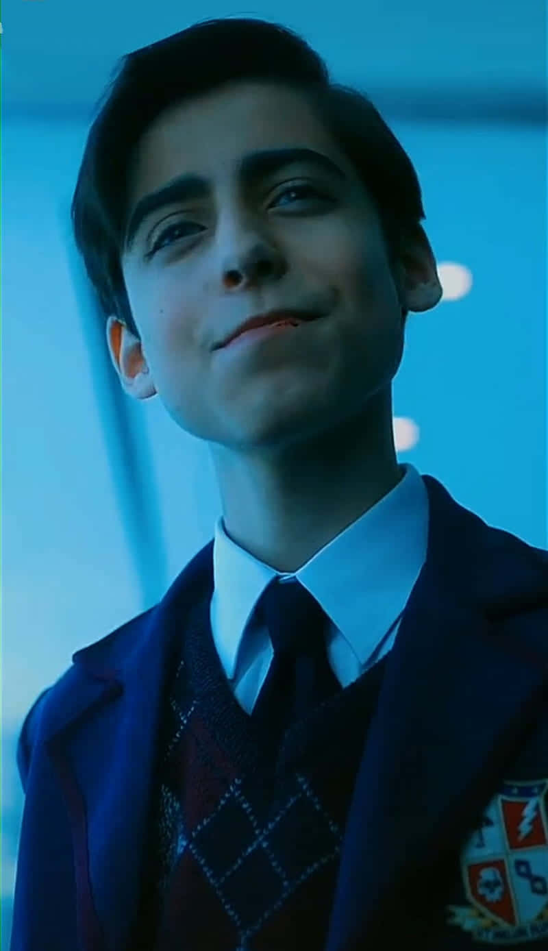 A Young Man In A School Uniform Background