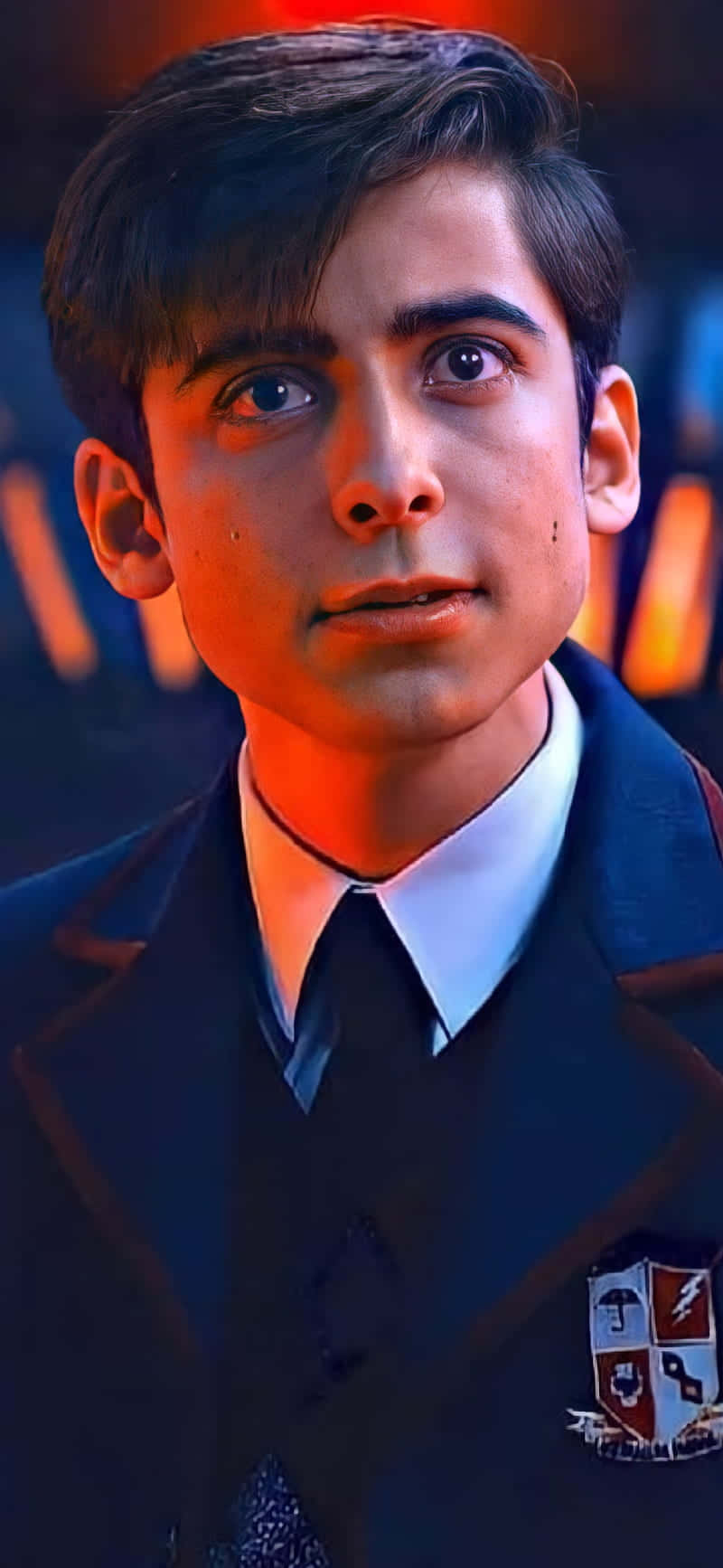 A Young Man In A Suit And Tie Background