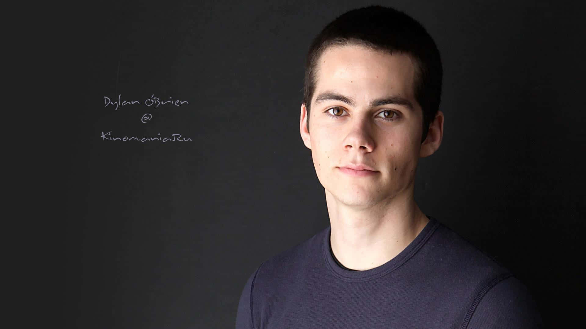 A Young Man Is Posing For A Photo Background