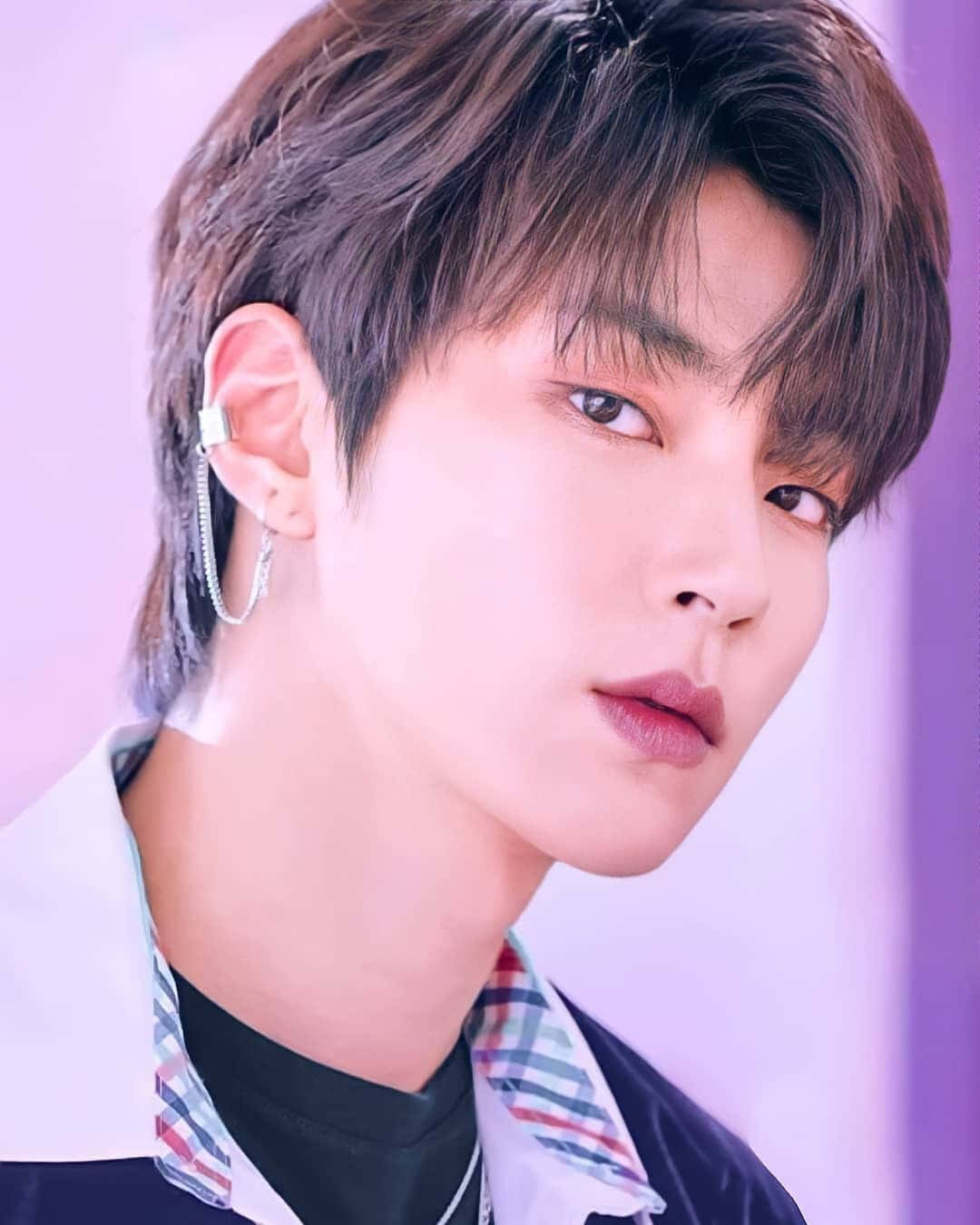 A Young Man With A Pierced Ear Background
