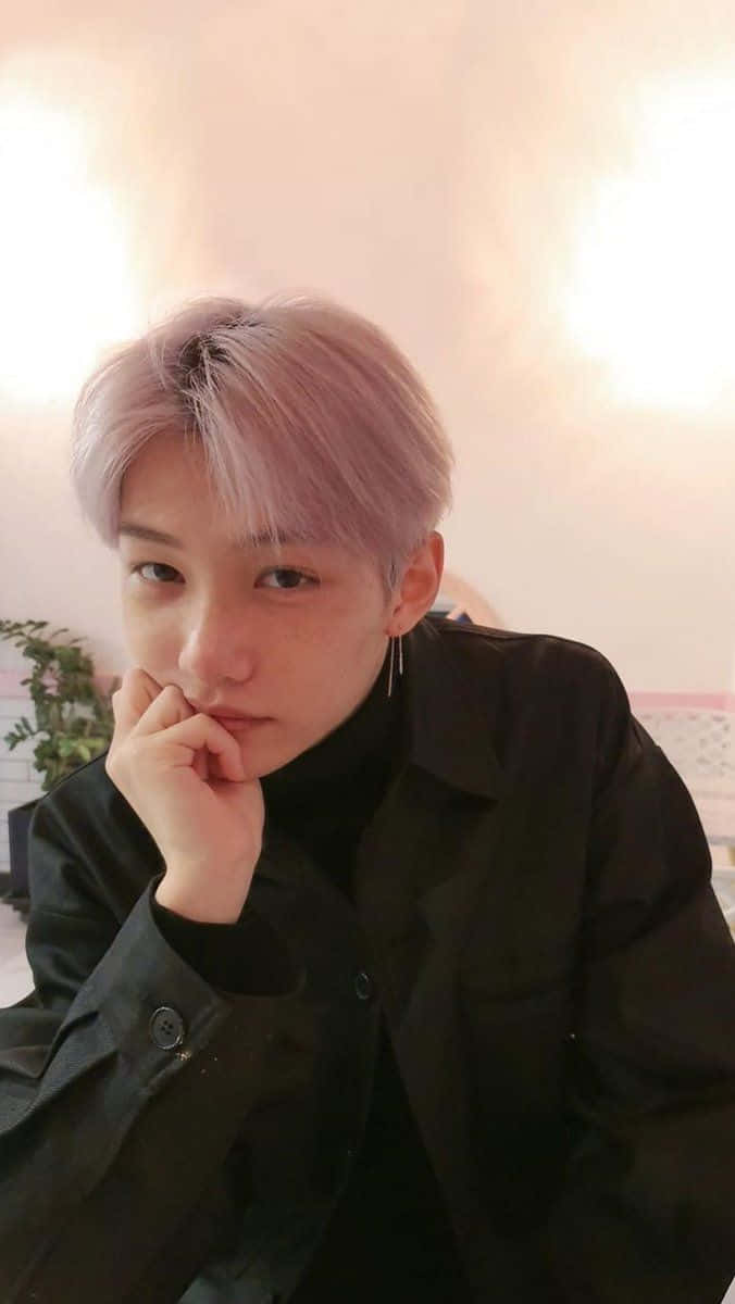 A Young Man With Pink Hair Posing For A Picture Background