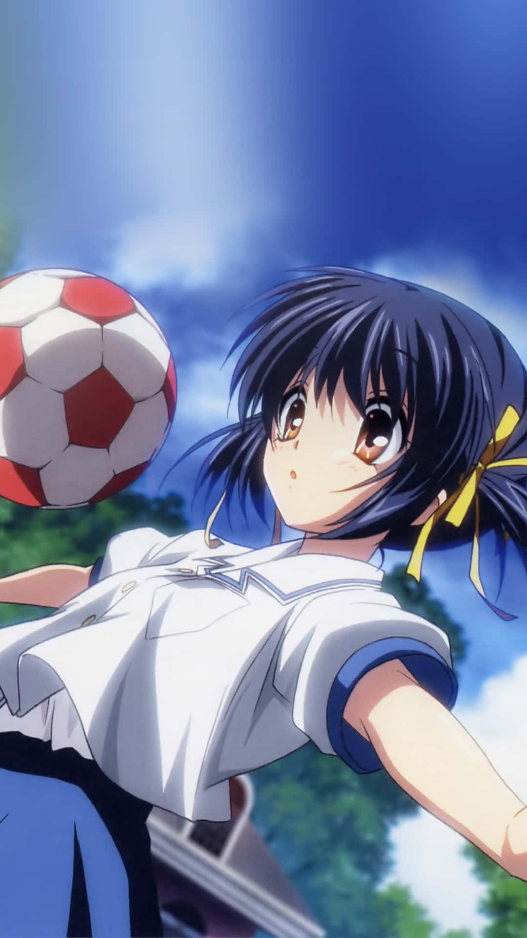 A Young Soccer Player Kicking The Ball Into The Goal Background