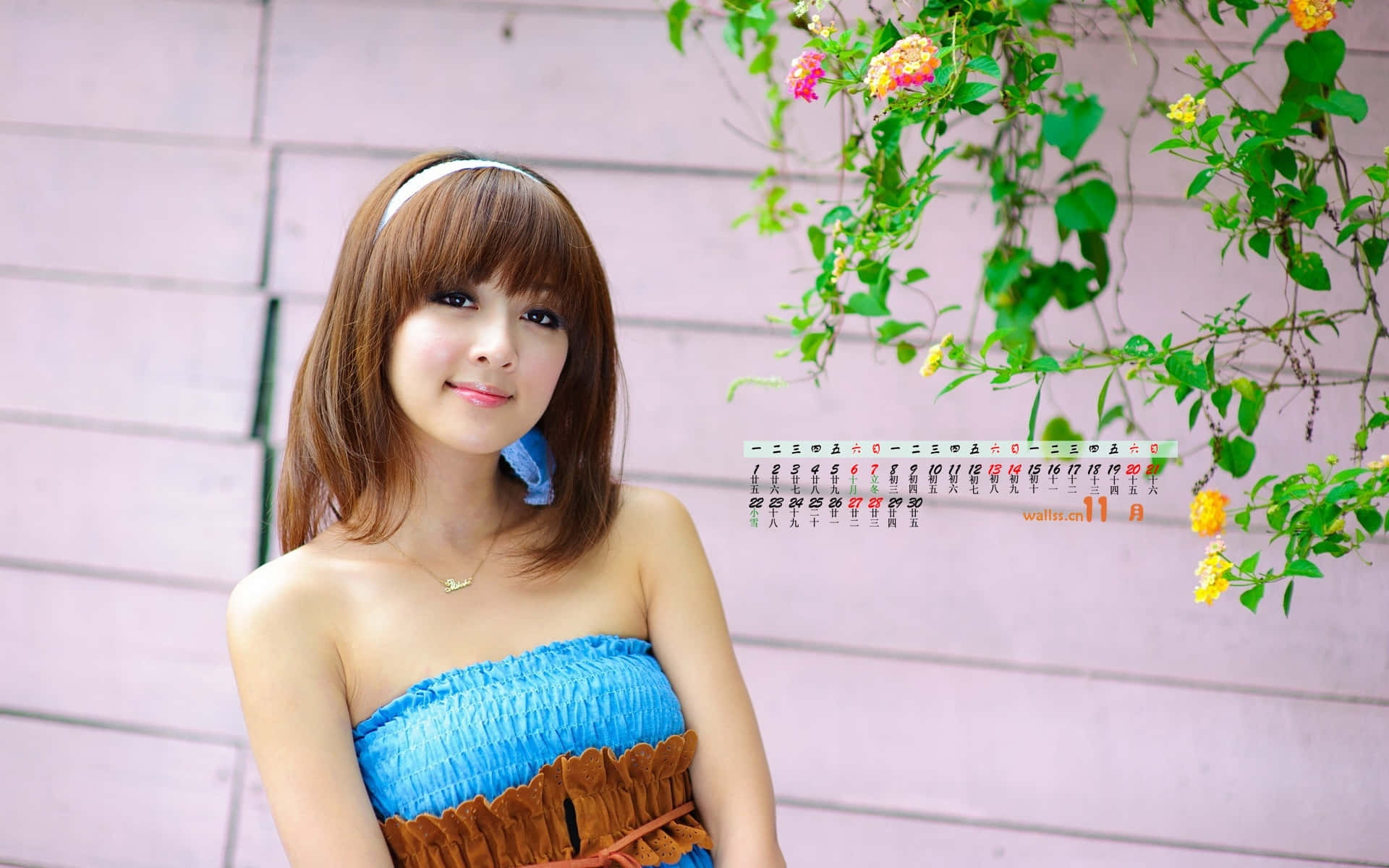 A Young Woman In A Blue Dress Posing For A Picture Background