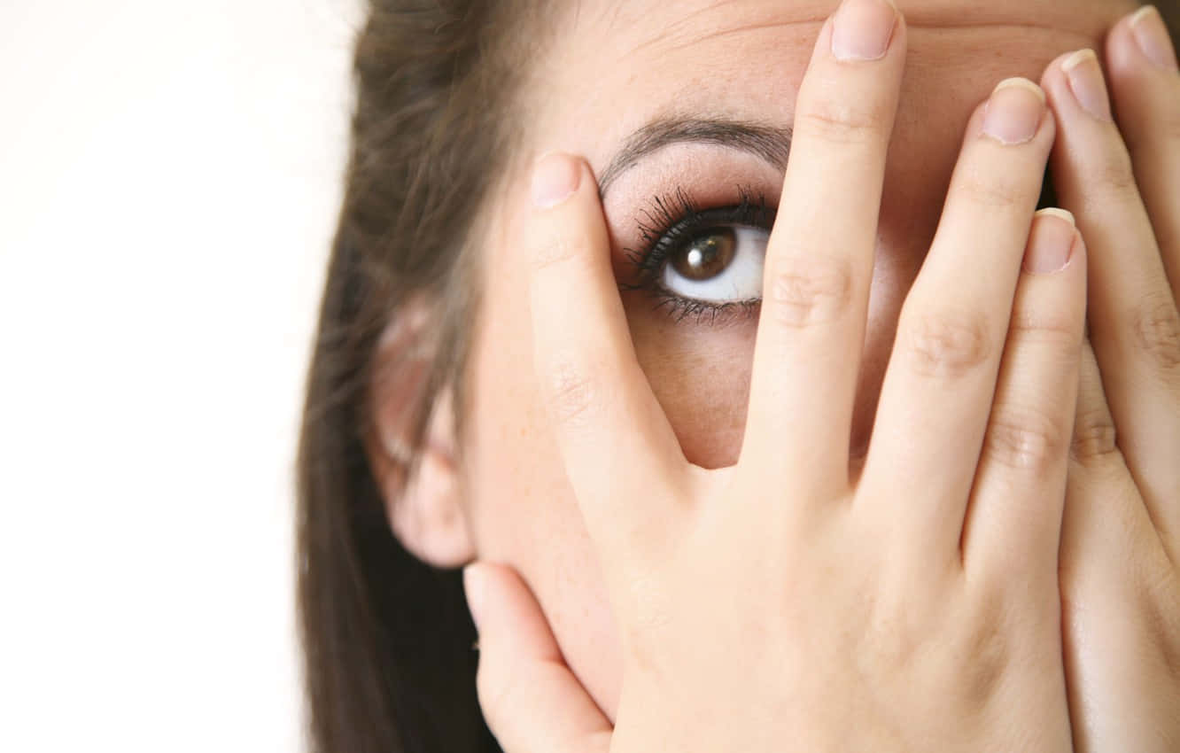 A Young Woman Laughing In An Awkward Situation
