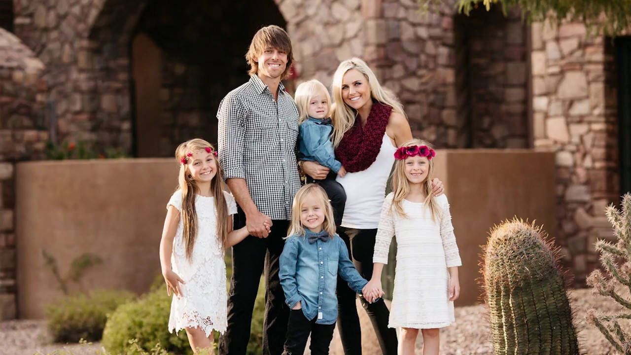 Aaron Baddeley And Family In Vacation Background