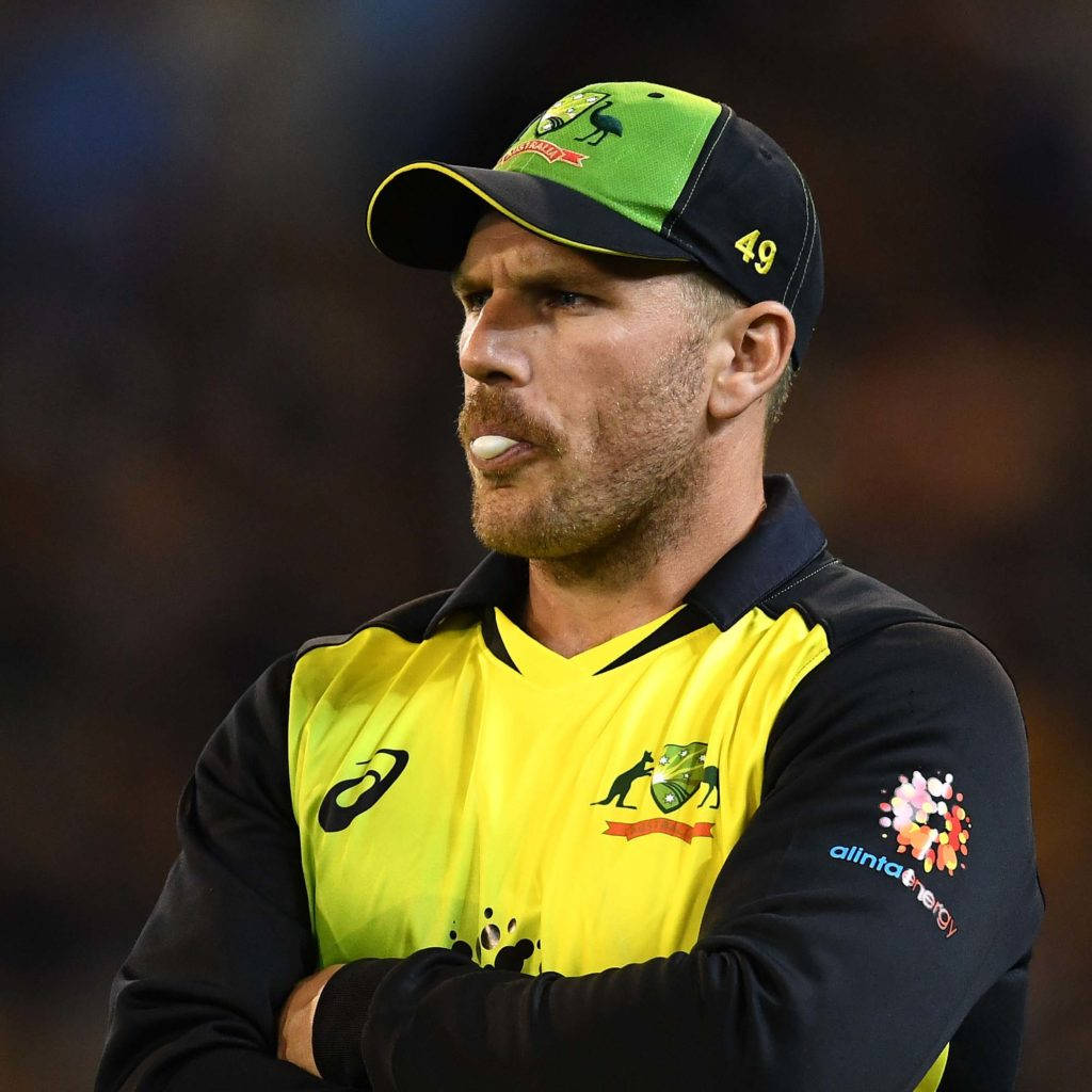 Aaron Finch Green And Black Cap Background