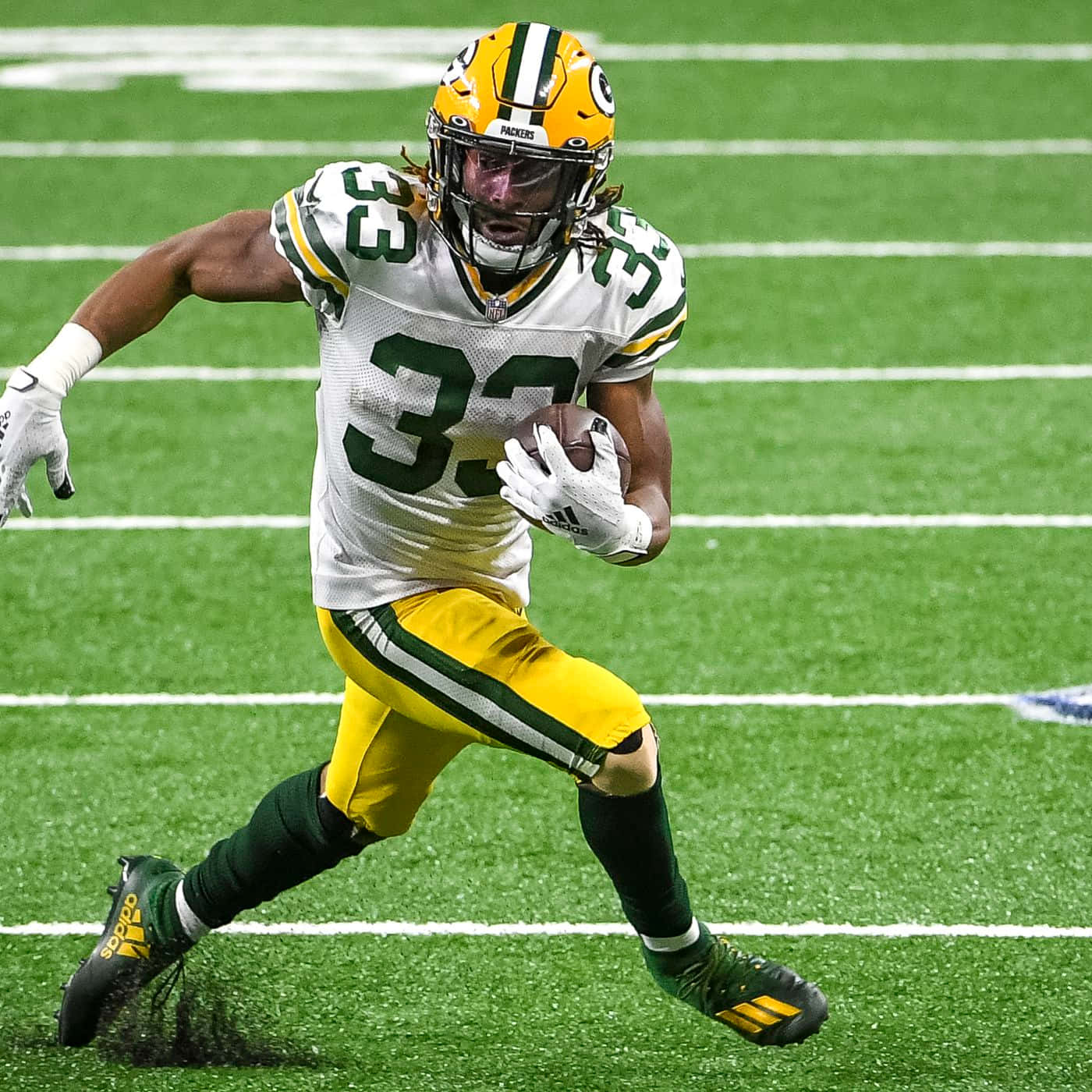 Aaron Jones Celebrates A Touchdown With The Green Bay Packers Background