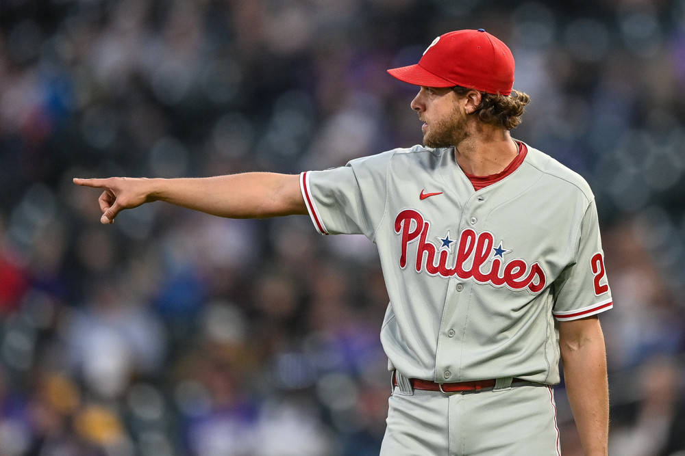 Aaron Nola, A Star Player, Pointing To Victory Background