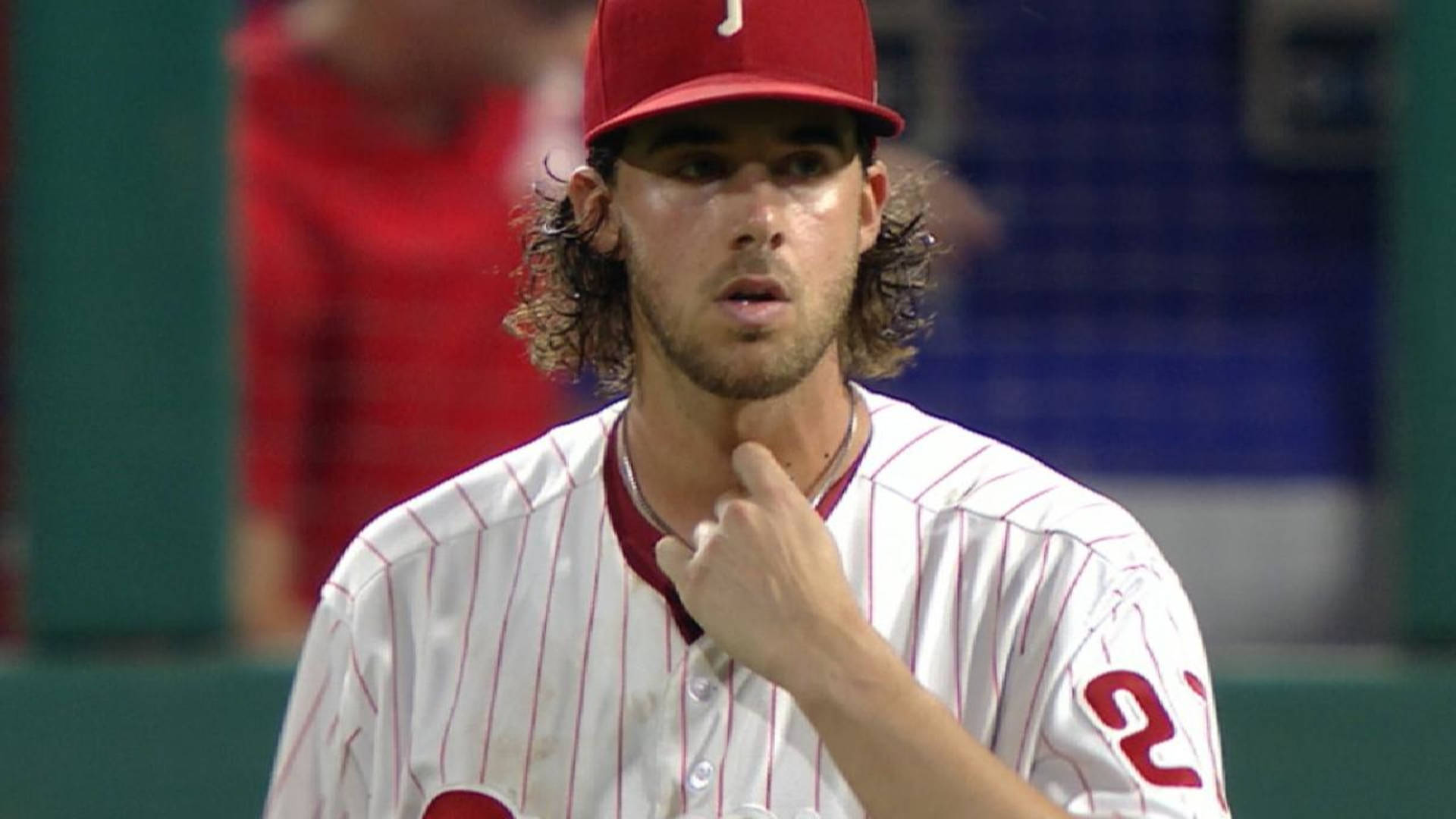 Aaron Nola Scratching Throat Background