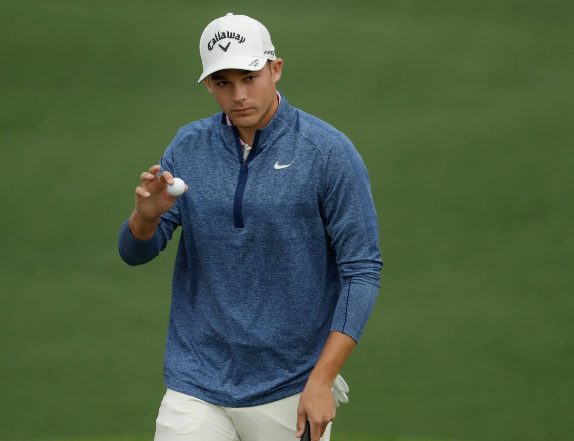 Aaron Wise Holding A Golf Ball