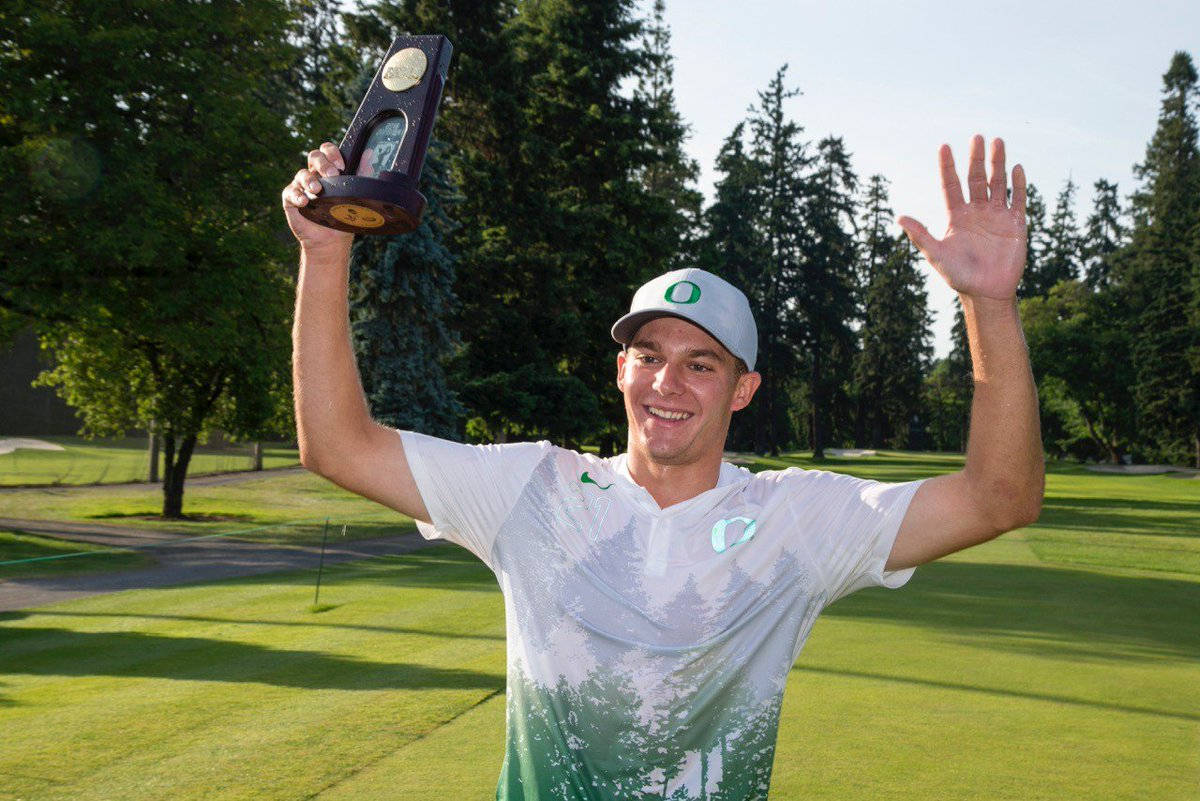 Aaron Wise Holding An Award Background