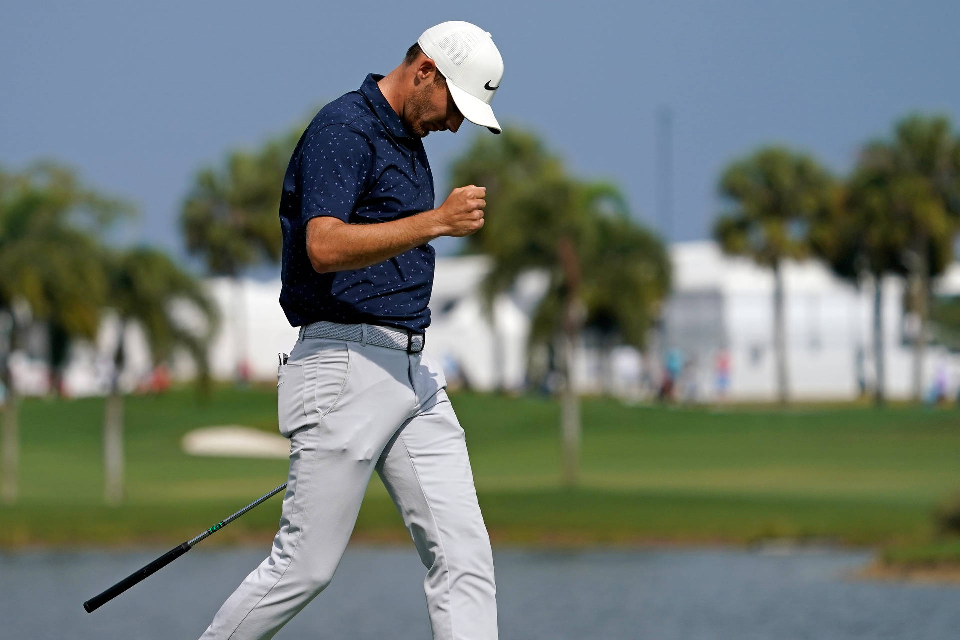 Aaron Wise Walking On Golf Course Background