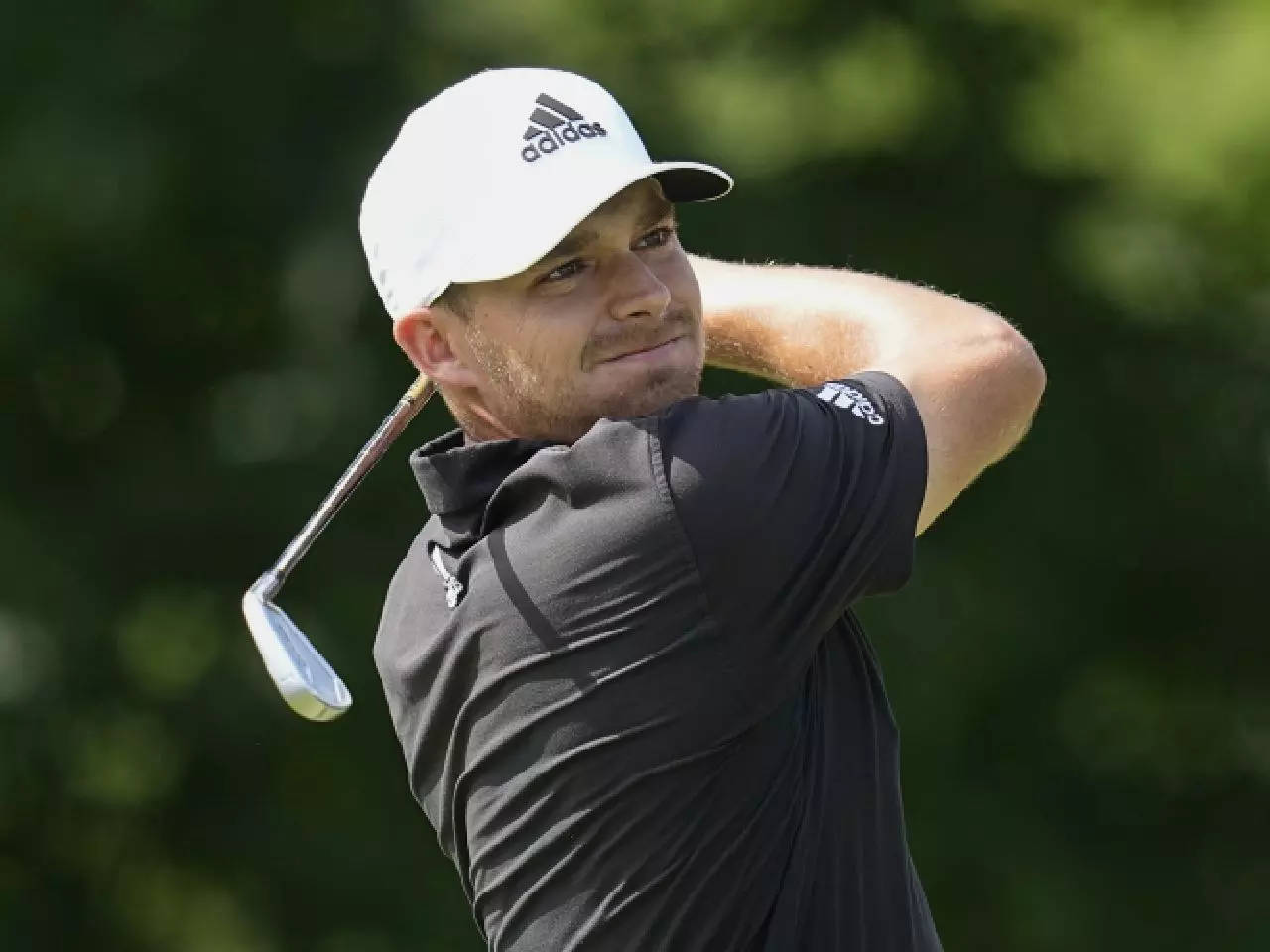 Aaron Wise Wearing An Adidas Cap Background