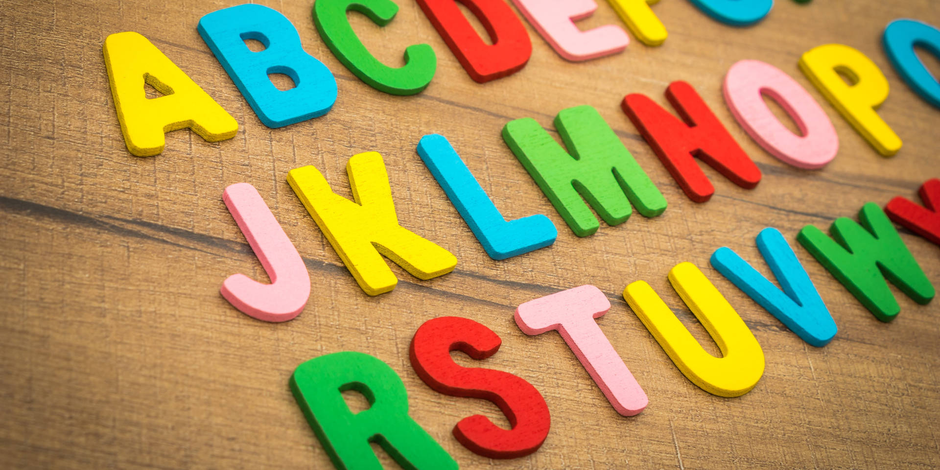 Abc Letters On Wooden Table Background