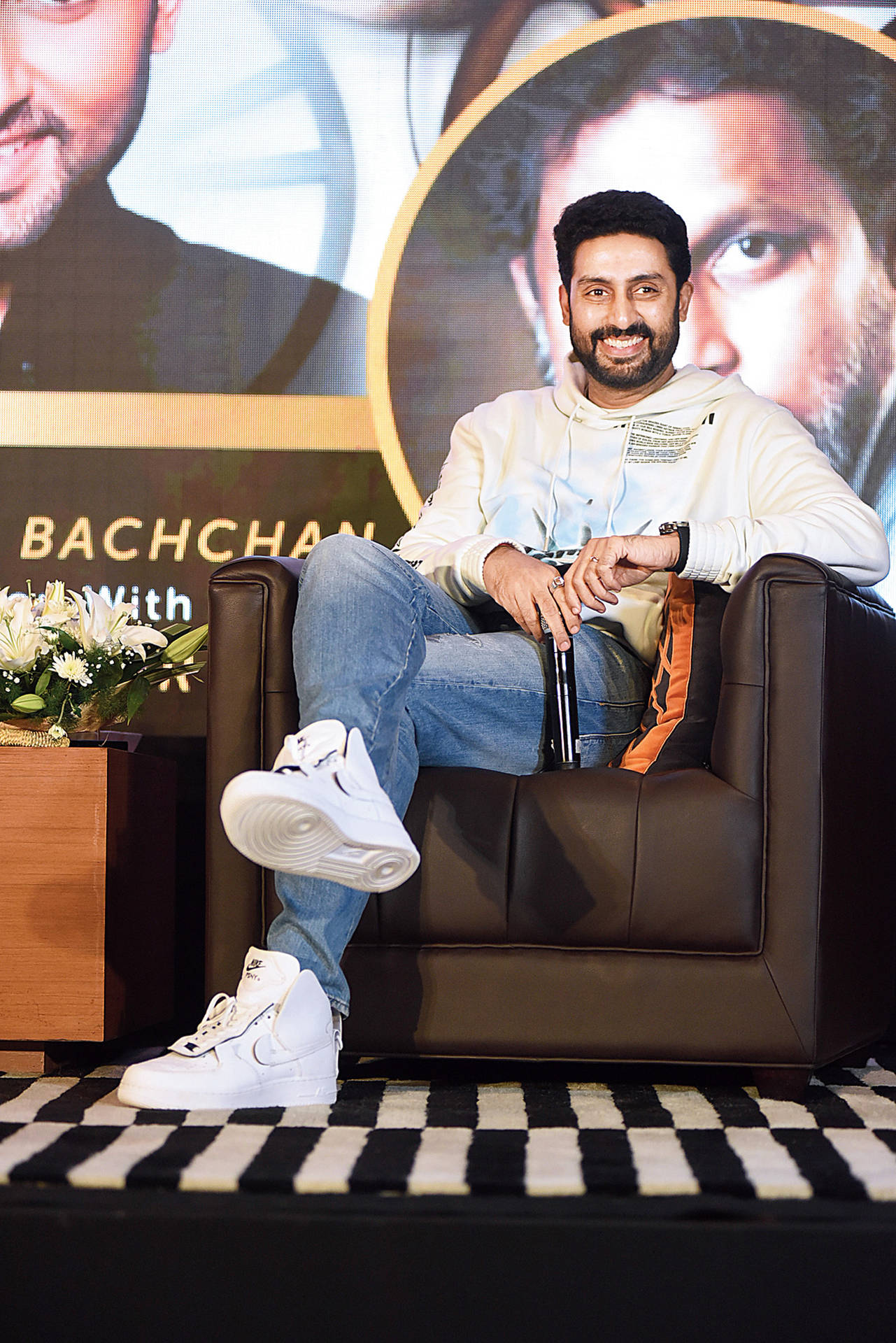 Abhishek Bachchan Sitting On Chair Background